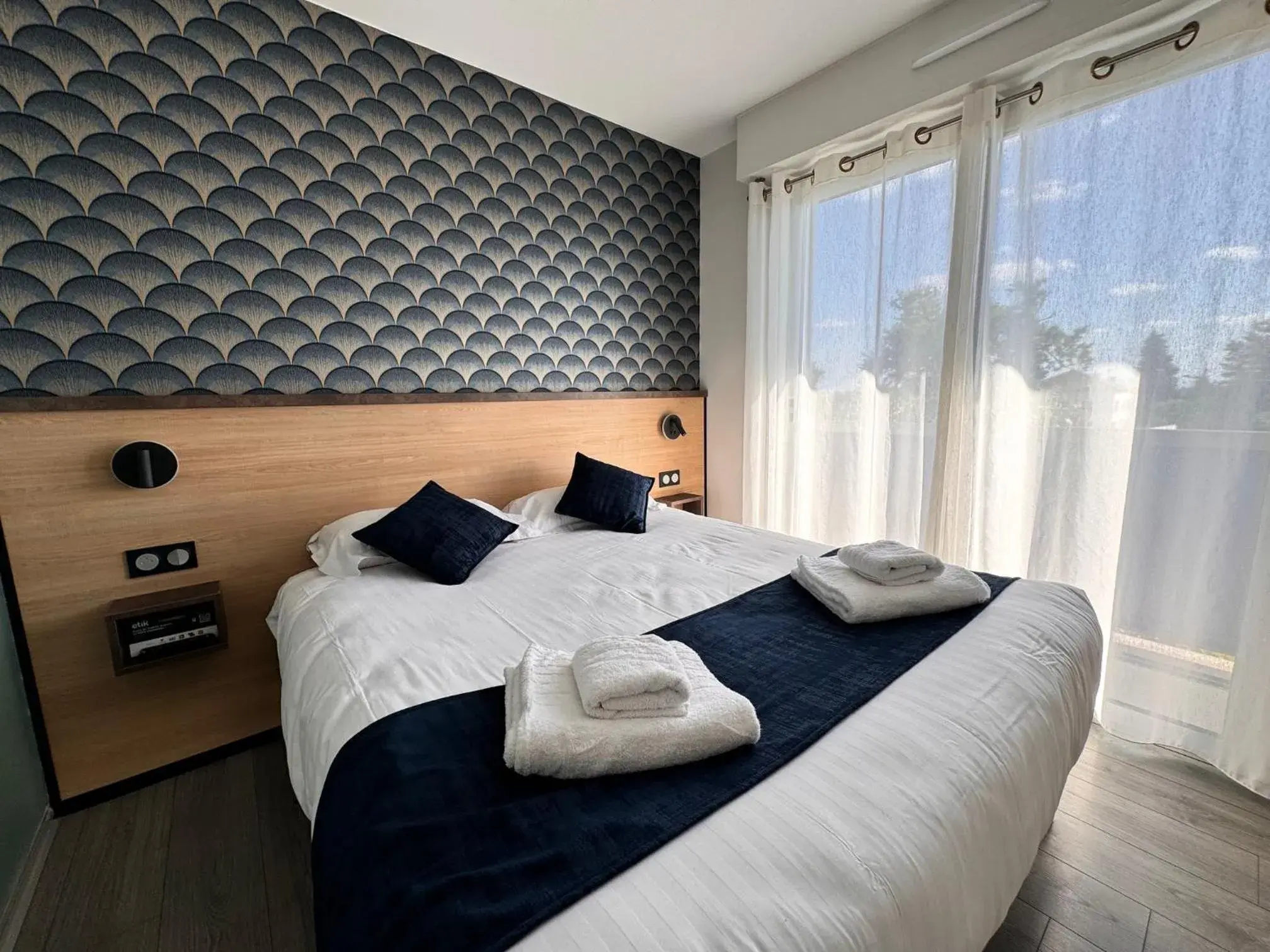 Photo of the whole room, Bed in Logis Hôtels Gnàc é Pause Photo of the whole room, Bed in Logis Hôtels Gnàc é Pause