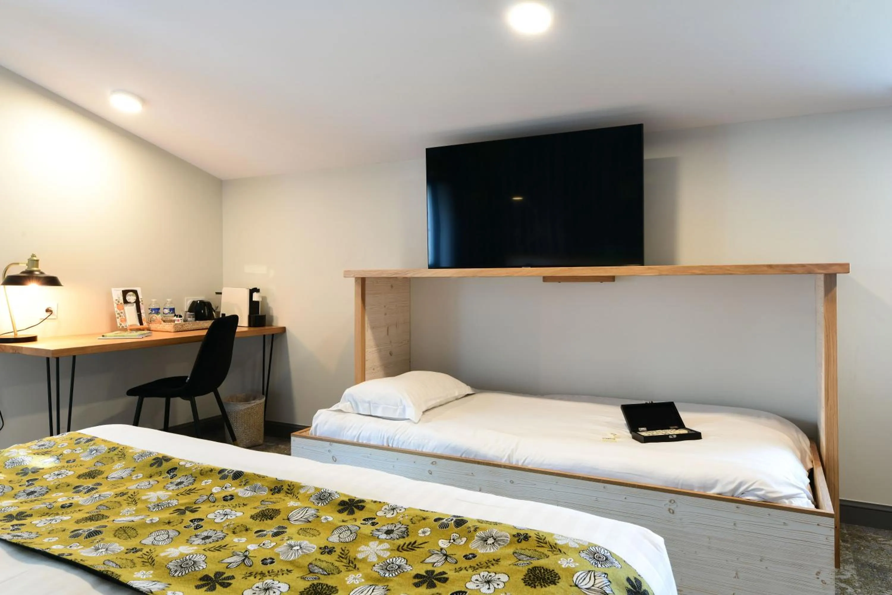 Bed in Logis Hôtels Gnàc é Pause