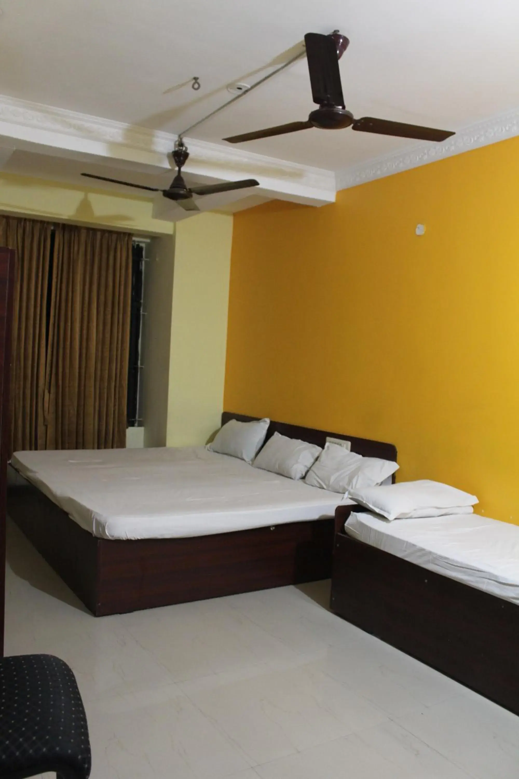 Economy Quadruple Room in Aishvarya Residency Economy Quadruple Room in Aishvarya Residency