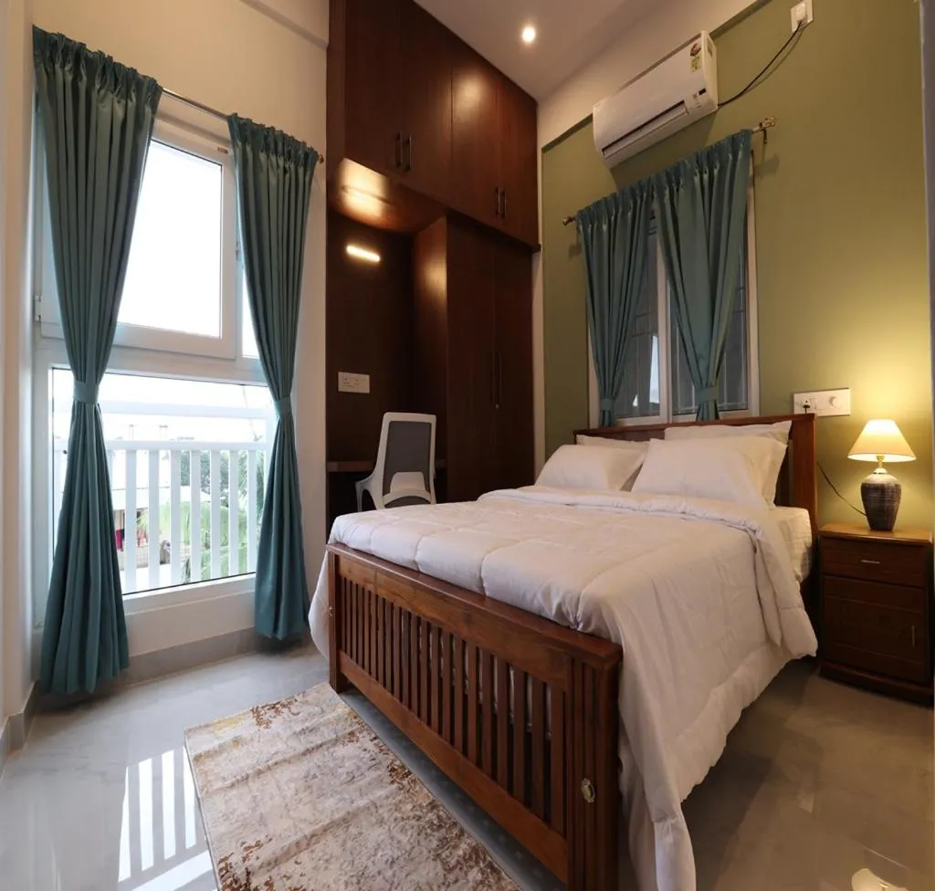 Bed in Olivette Suites