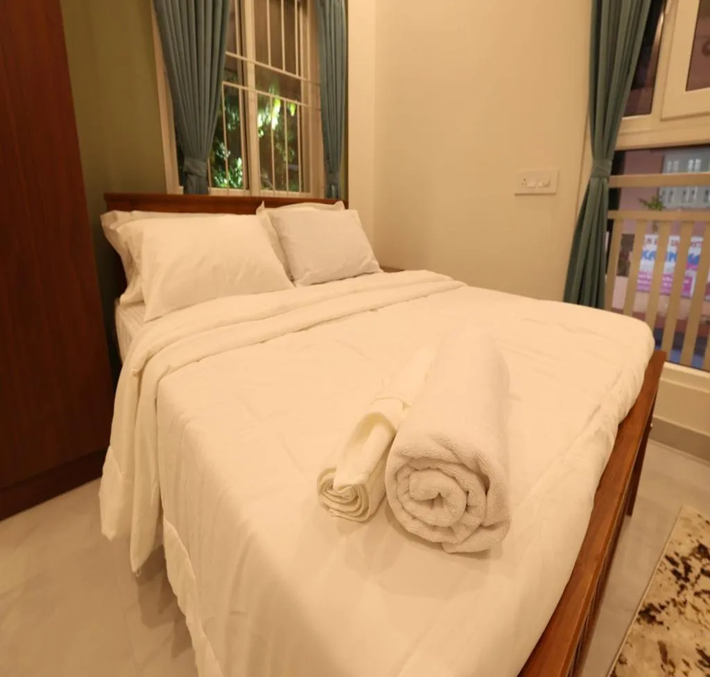 Bed in Olivette Suites