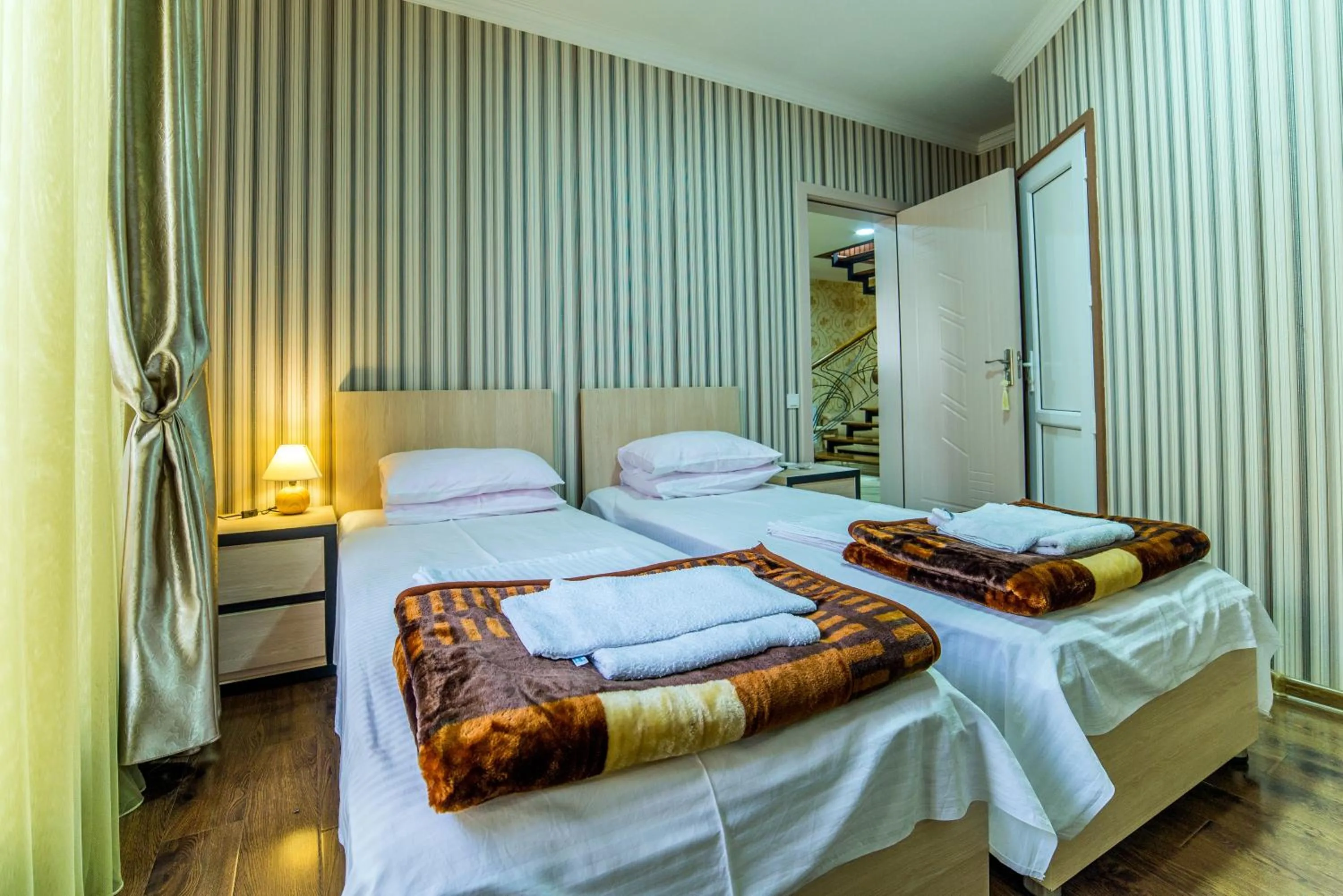 Bed in HOTEL GUGLUX &WINE CELLAR