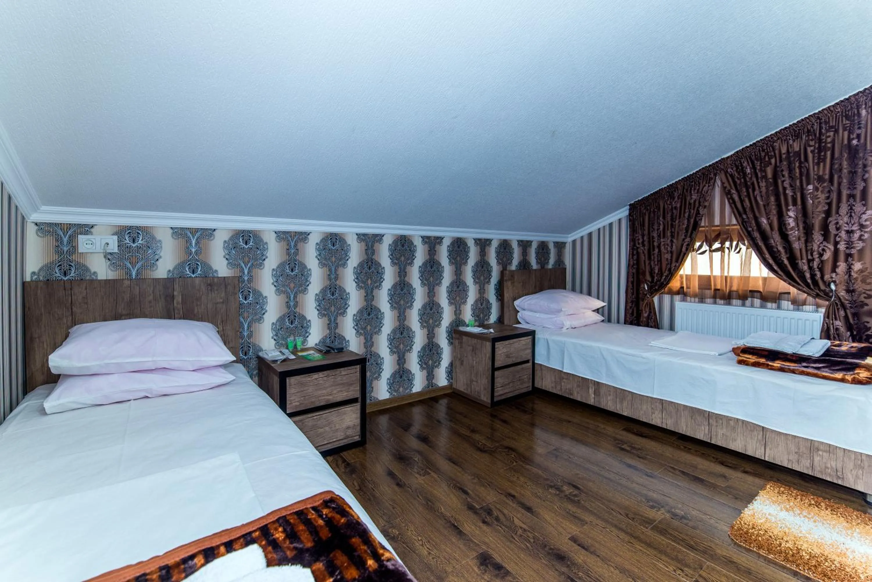 Bed in HOTEL GUGLUX &WINE CELLAR