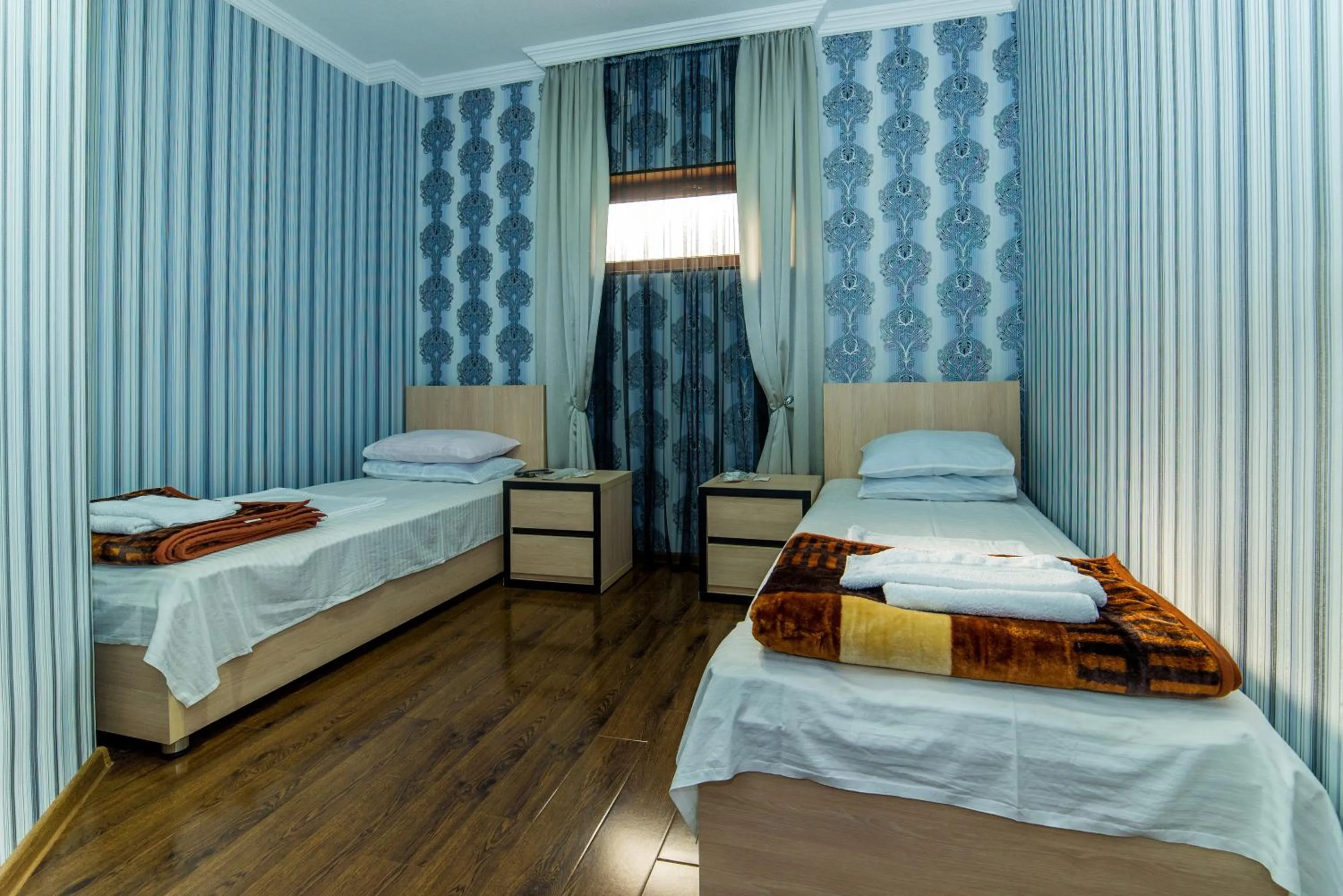 Bed in HOTEL GUGLUX &WINE CELLAR