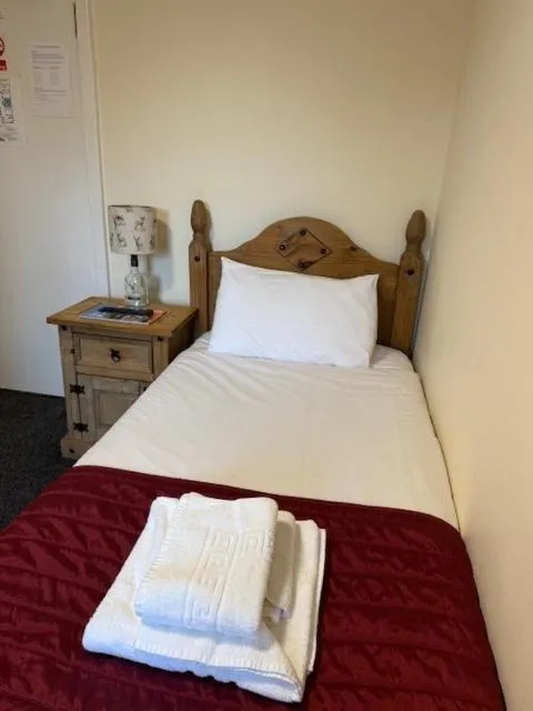 Bed in Novar Arms Hotel
