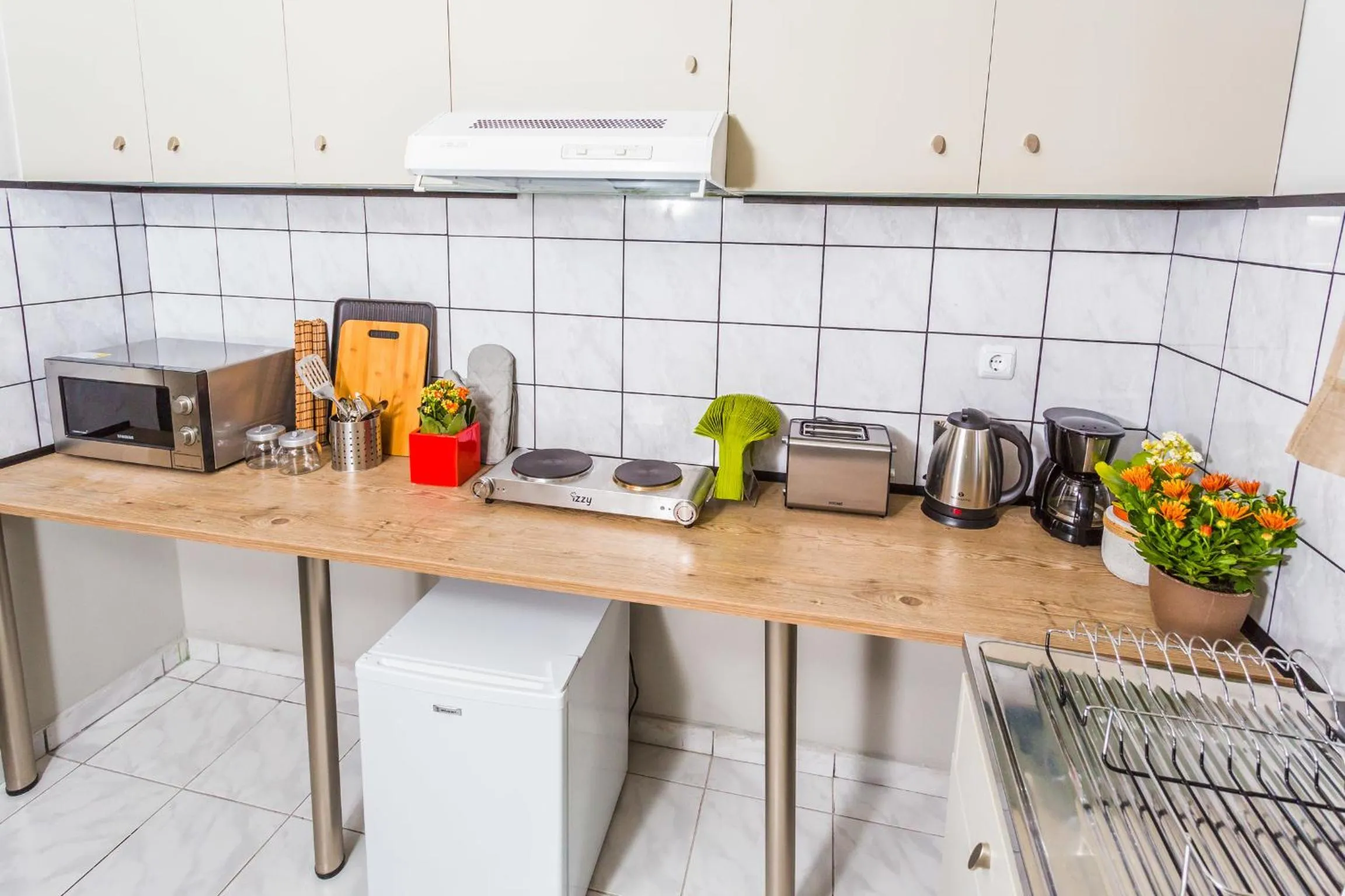 Kitchen or kitchenette in Aris Athens Suites