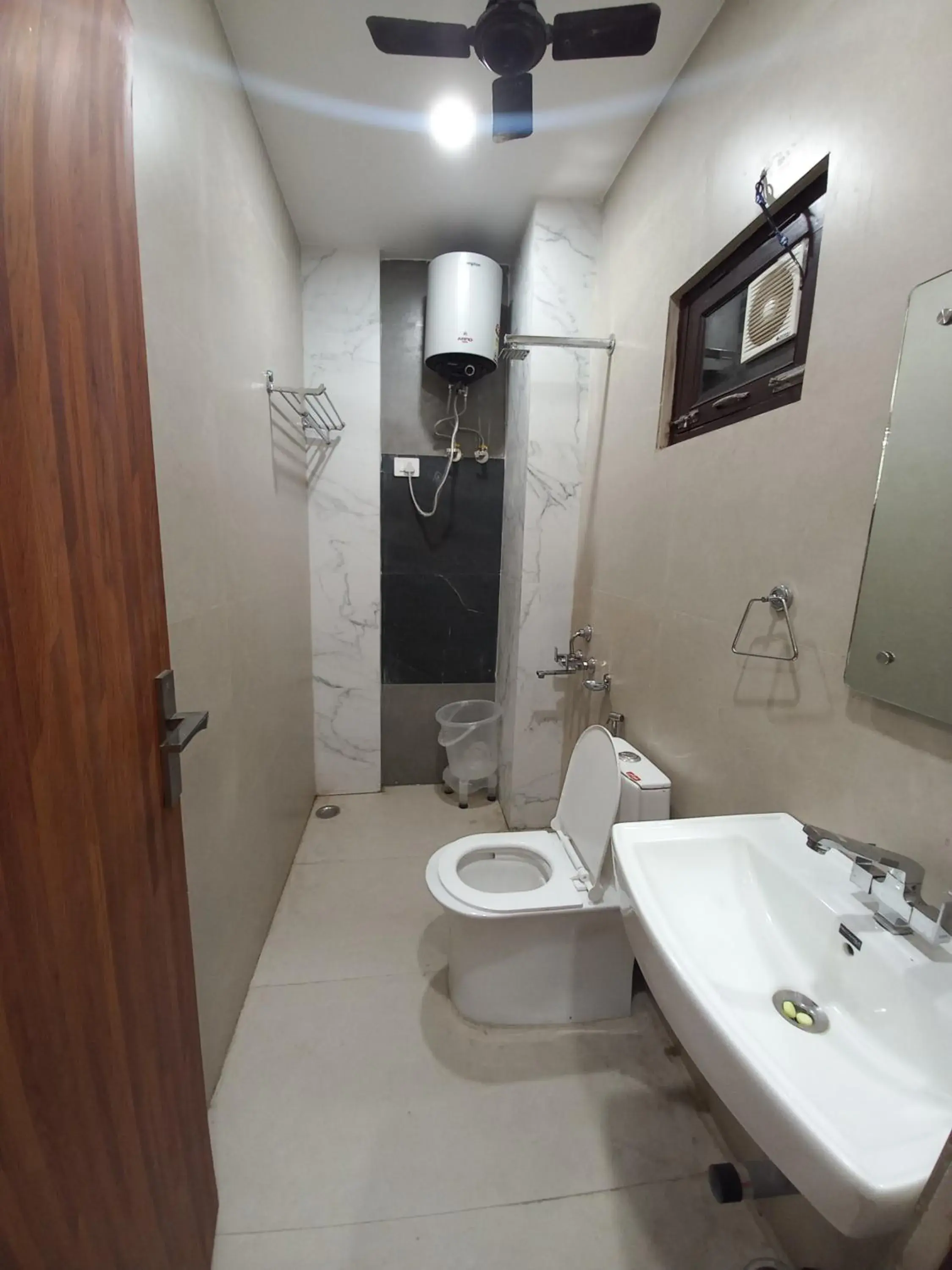 Bathroom in Hotel Aaradhya Residency Bathroom in Hotel Aaradhya Residency