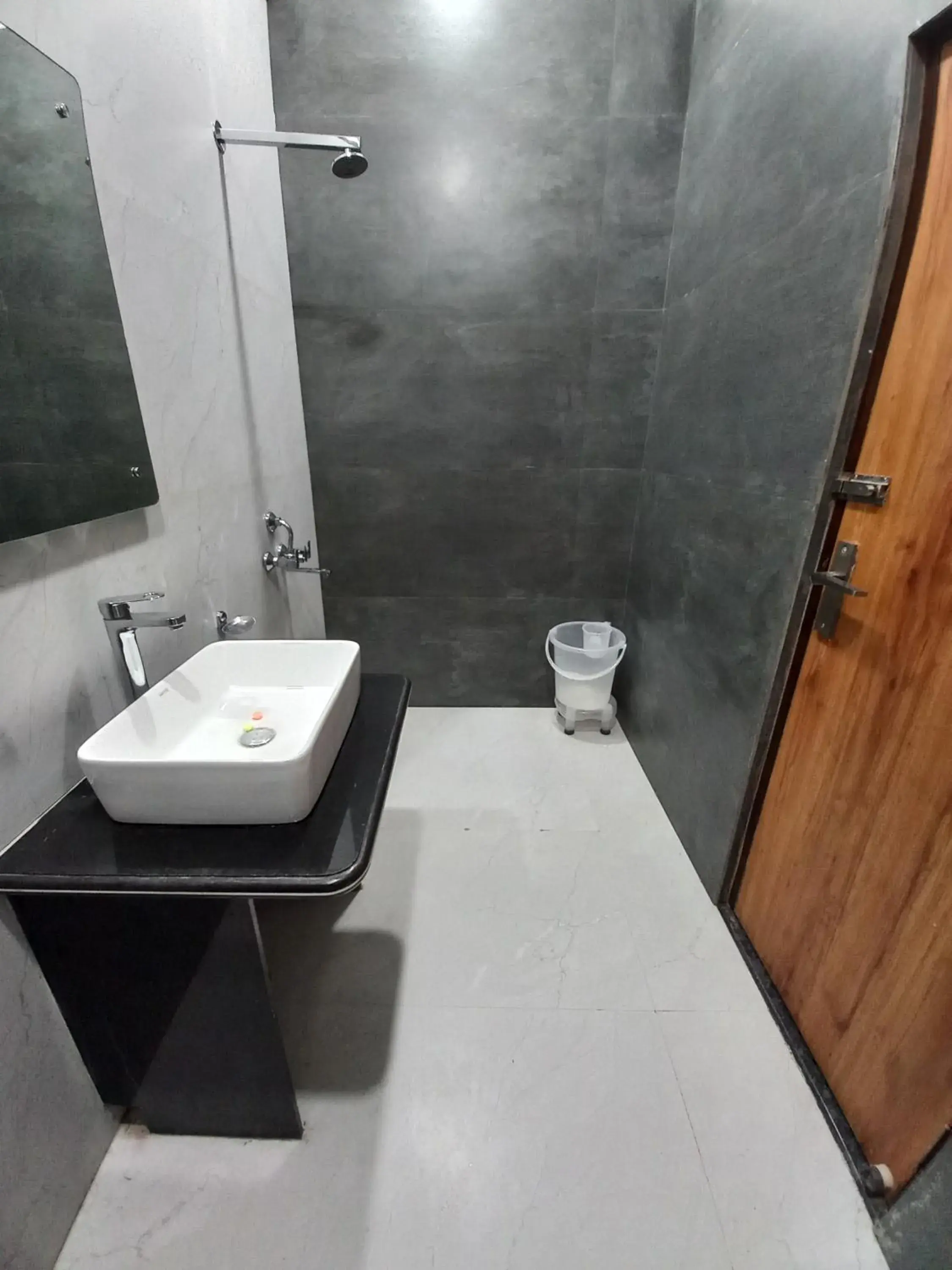 Bathroom in Hotel Aaradhya Residency Bathroom in Hotel Aaradhya Residency