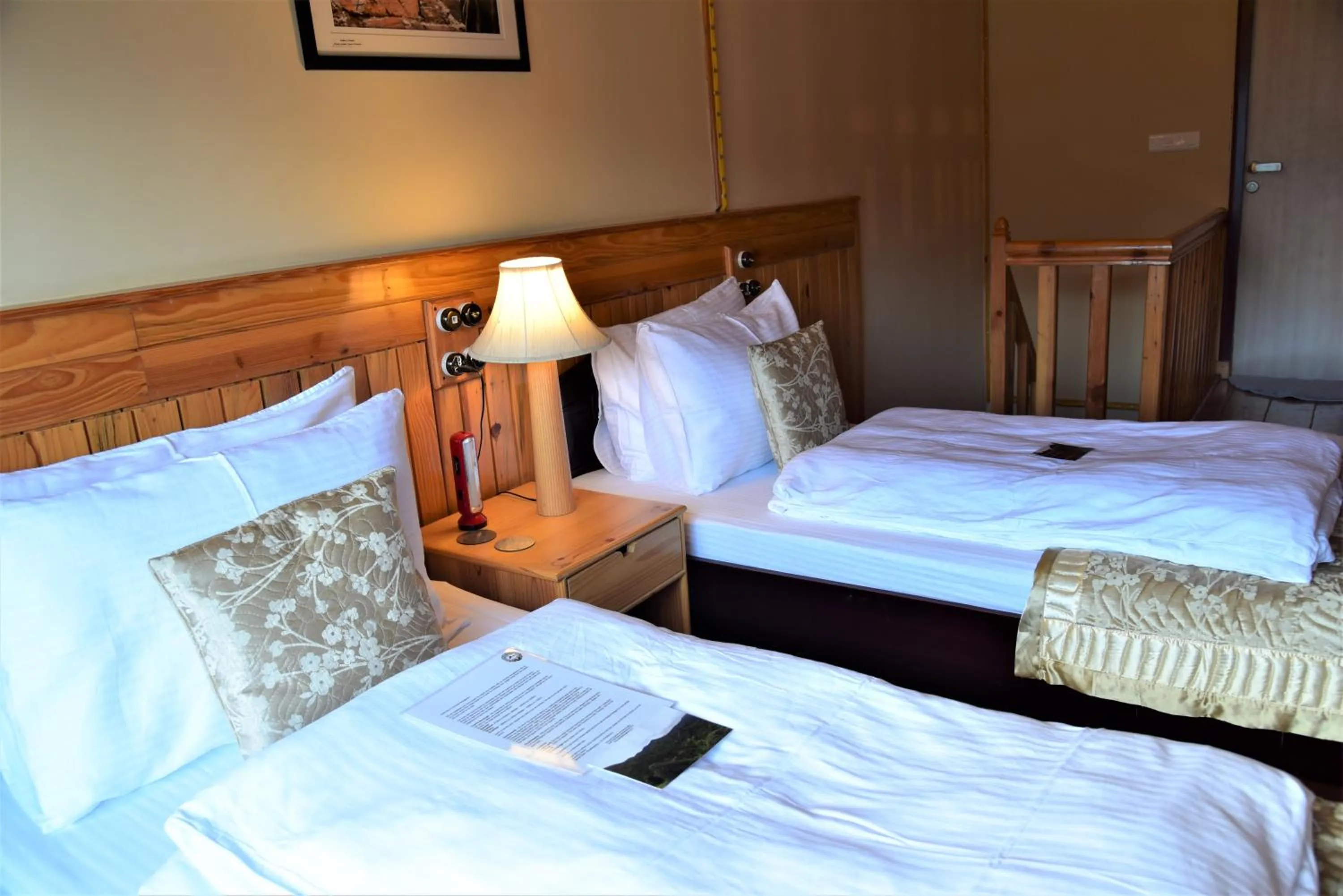 Bed in Parvada Bungalows