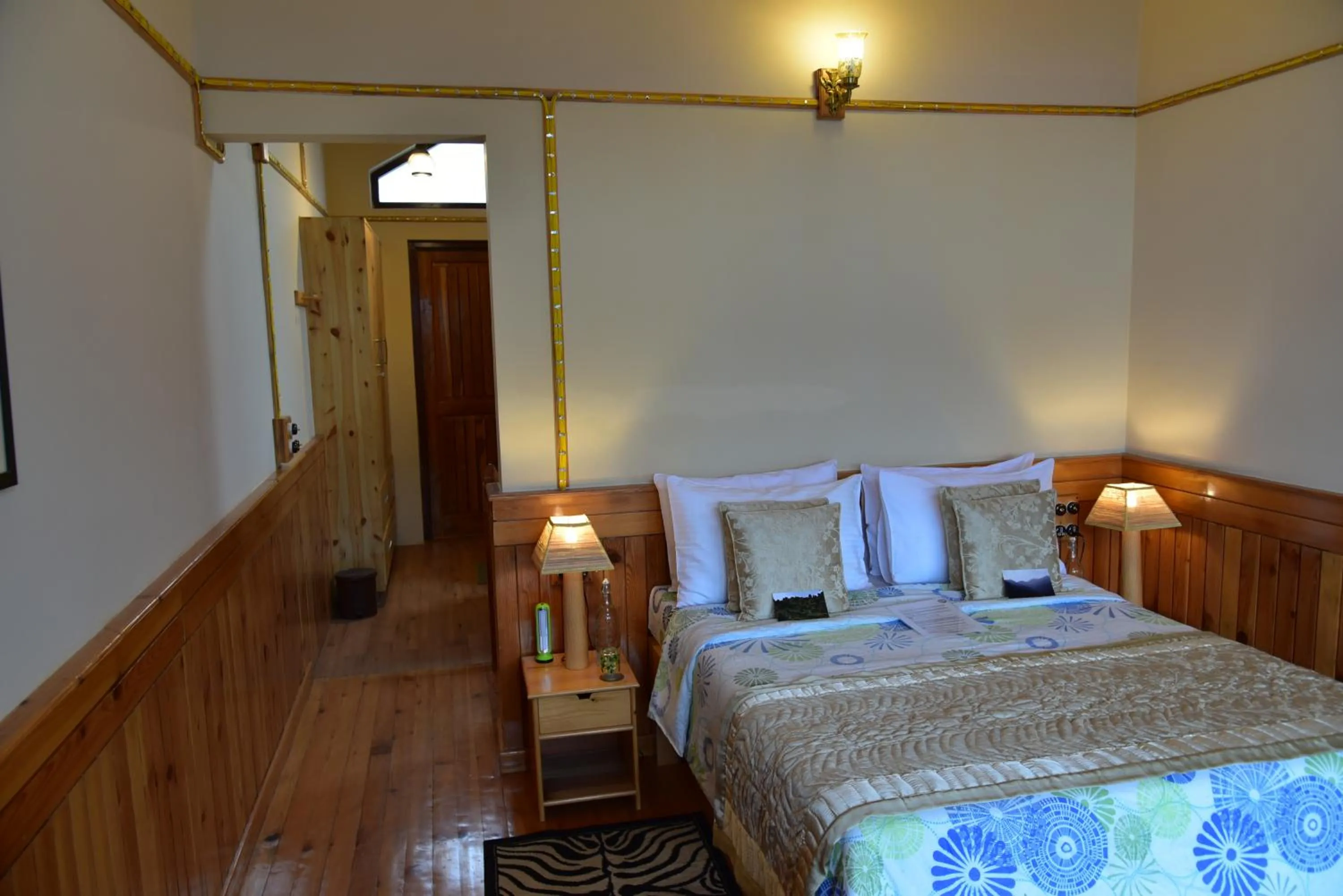Bed in Parvada Bungalows