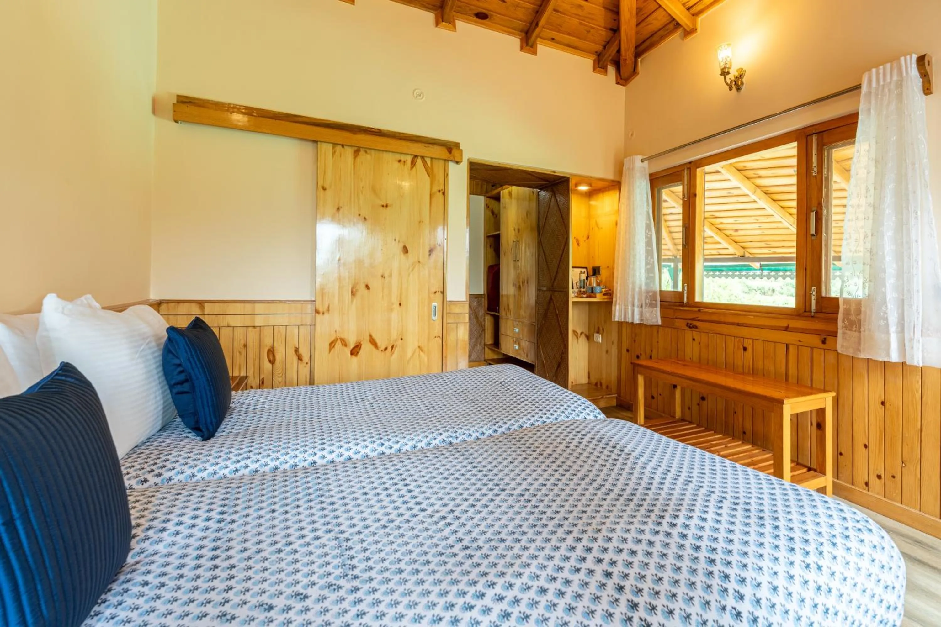 Bed in Parvada Bungalows