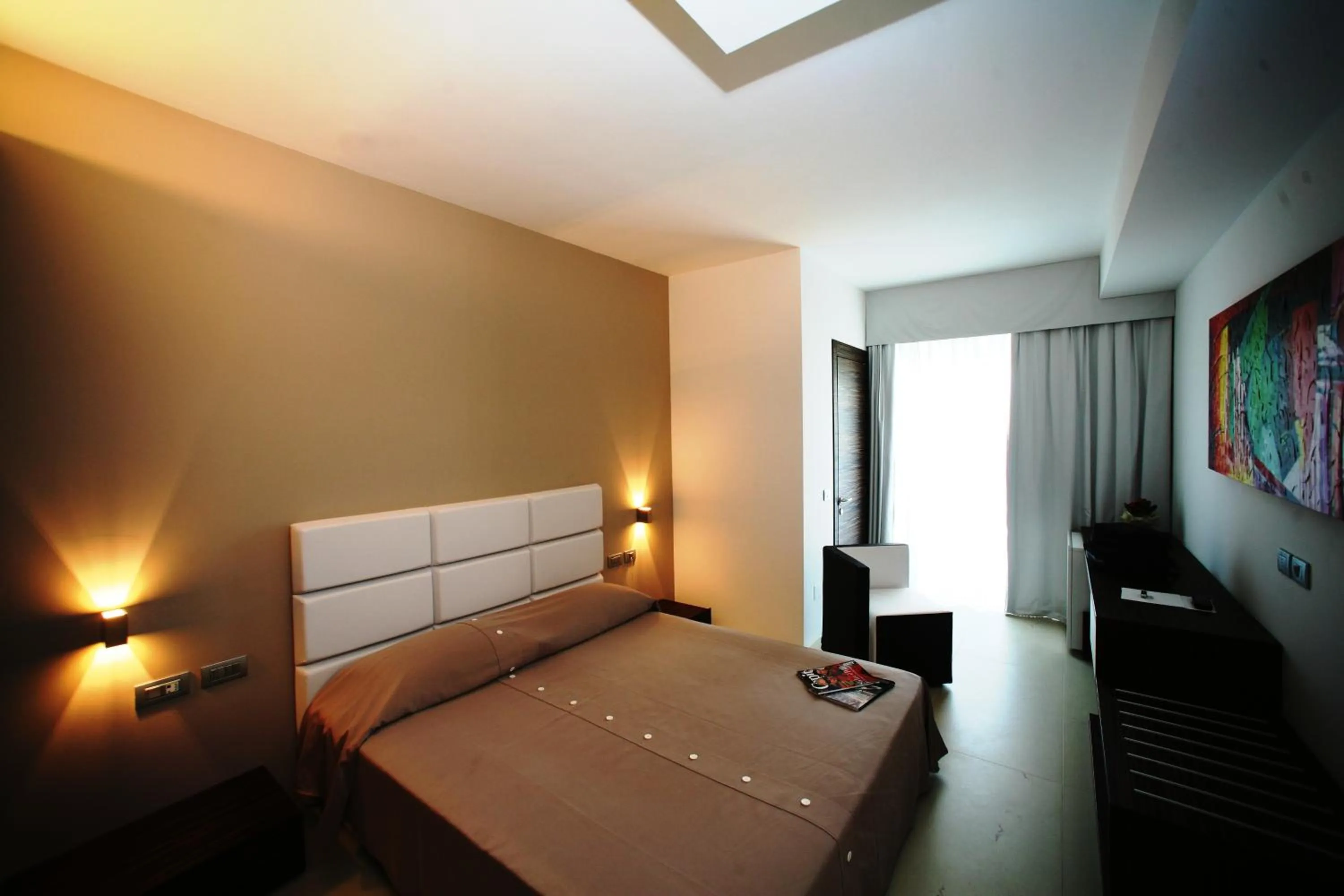 Photo of the whole room, Bed in White Hotel