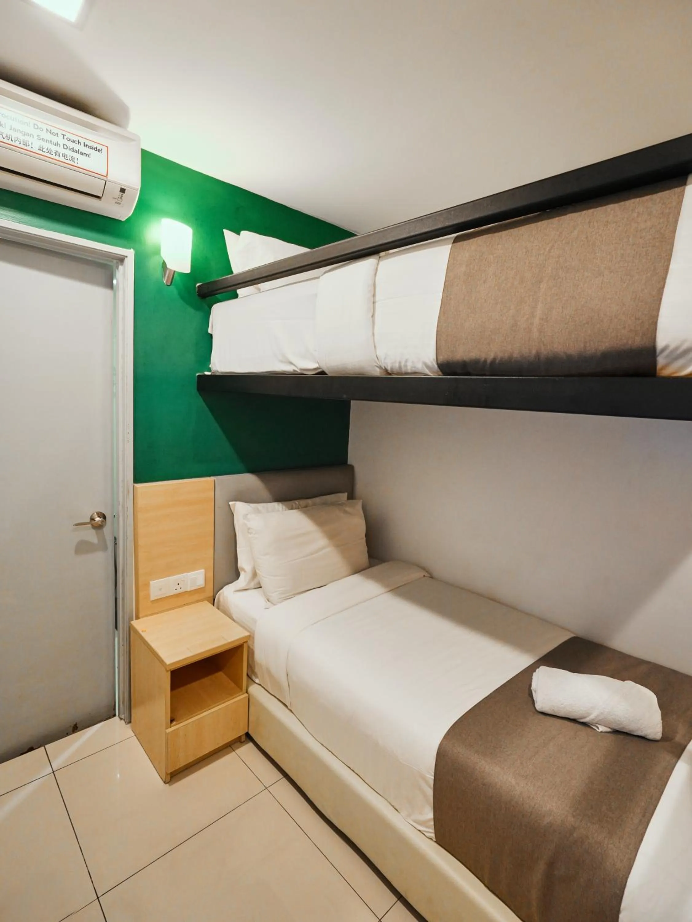 Bed in Eco Roomy Hotel