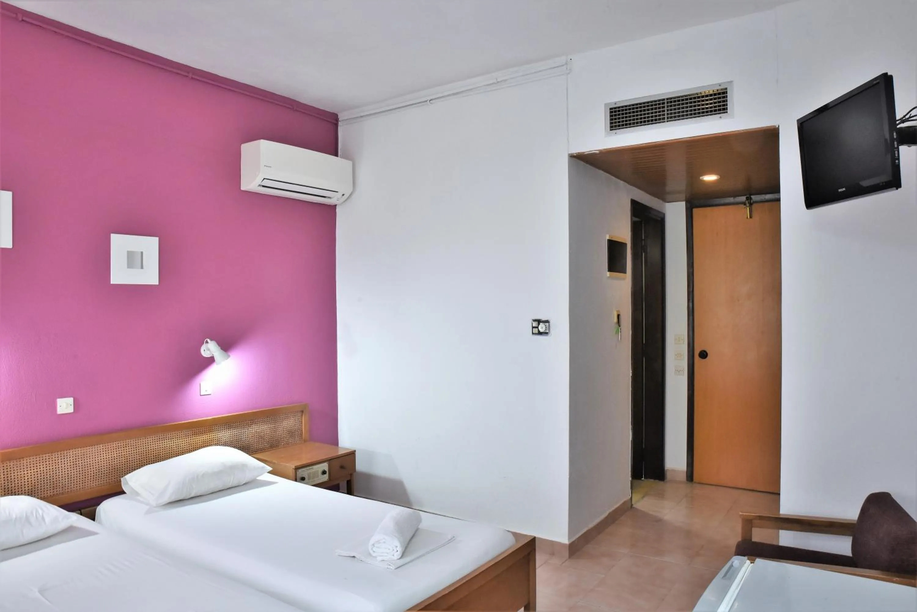 Bed in Telhinis Hotel & Apartments