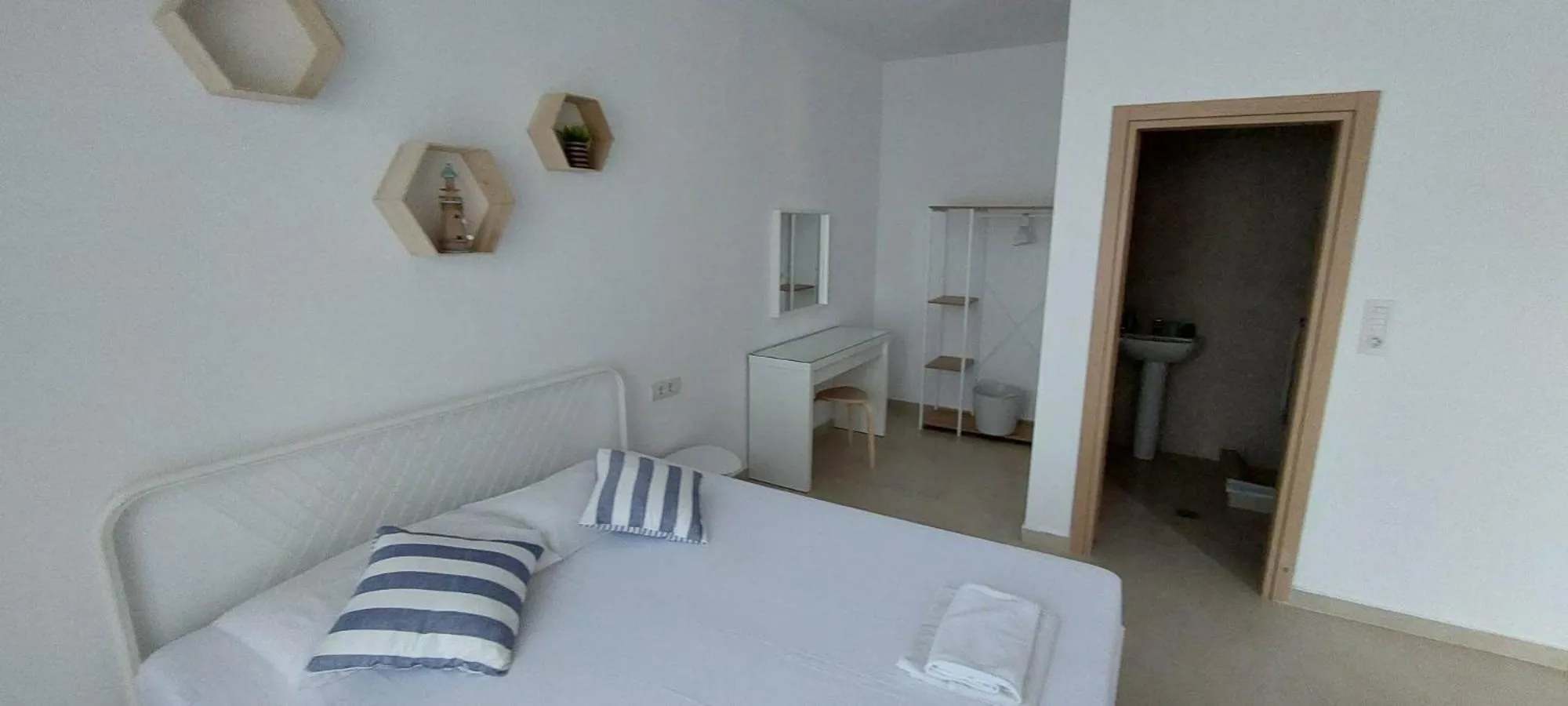 Bed in Telhinis Hotel & Apartments