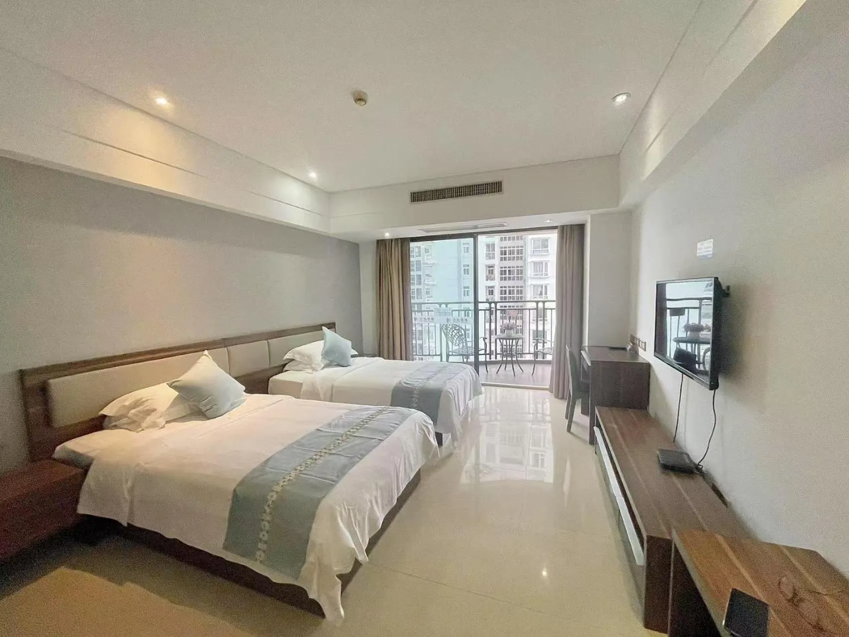 Photo of the whole room, Bed in Sanya Xintai Seaview Hotel