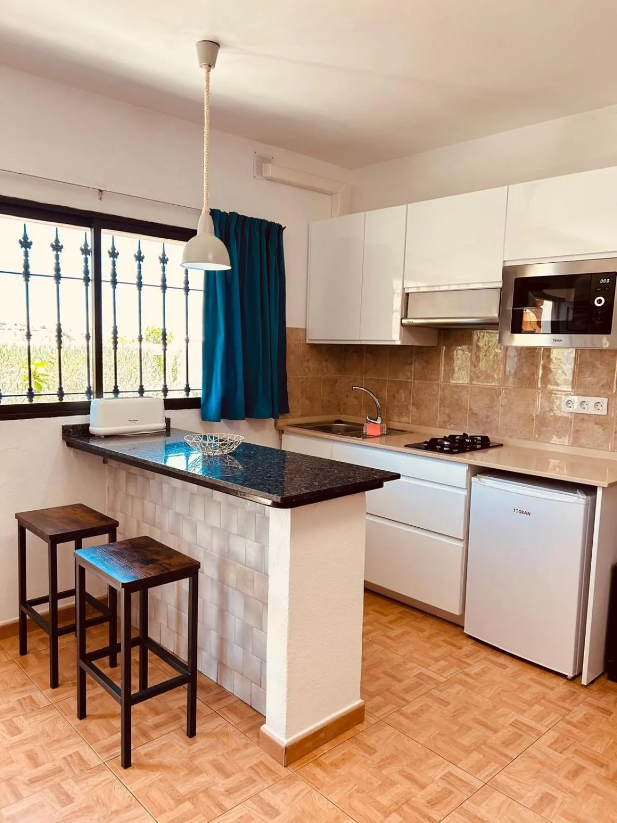 Kitchen or kitchenette in Apartamentos Alberto