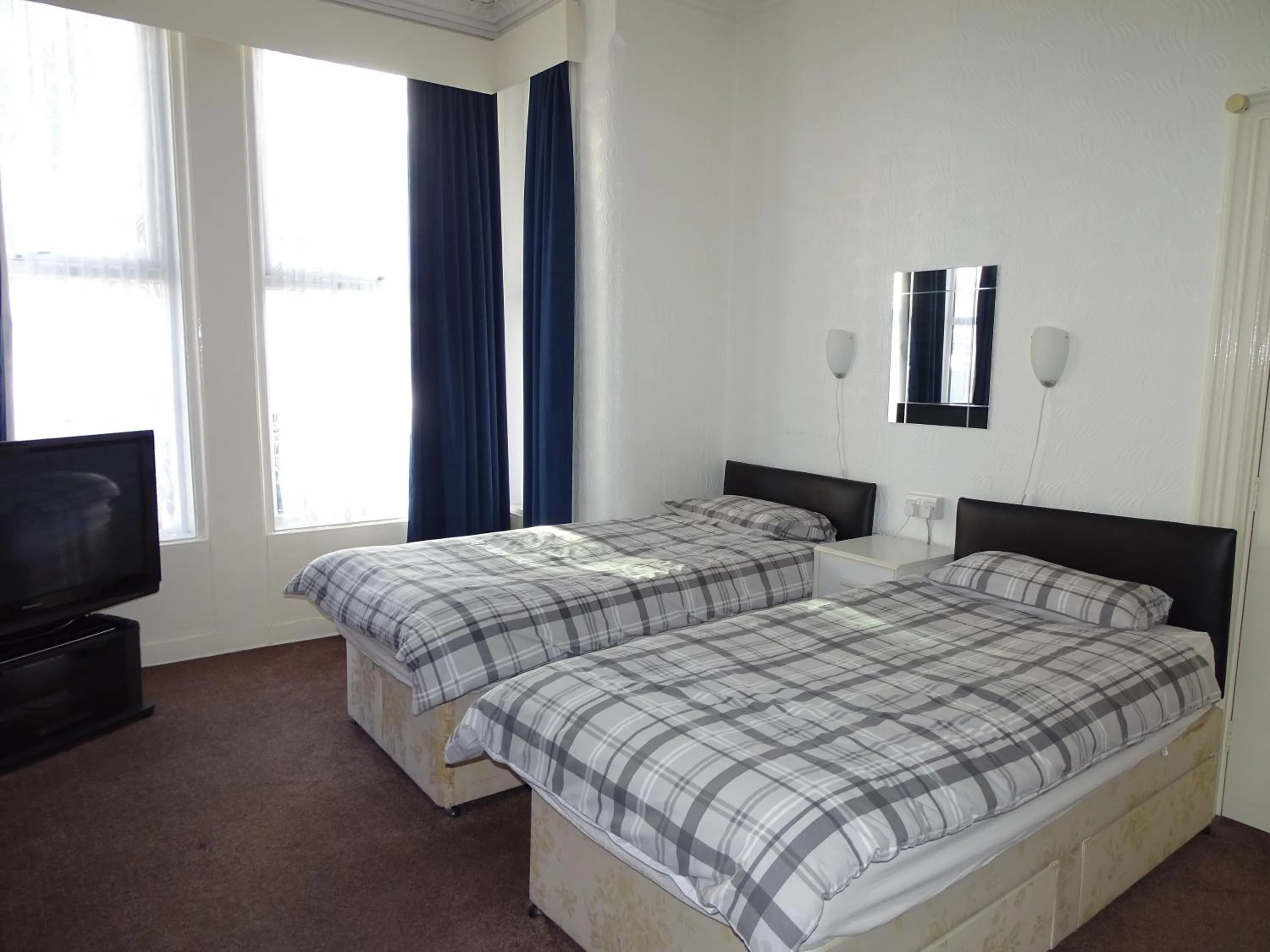 Bed in Beeton Villas Holiday Apartments