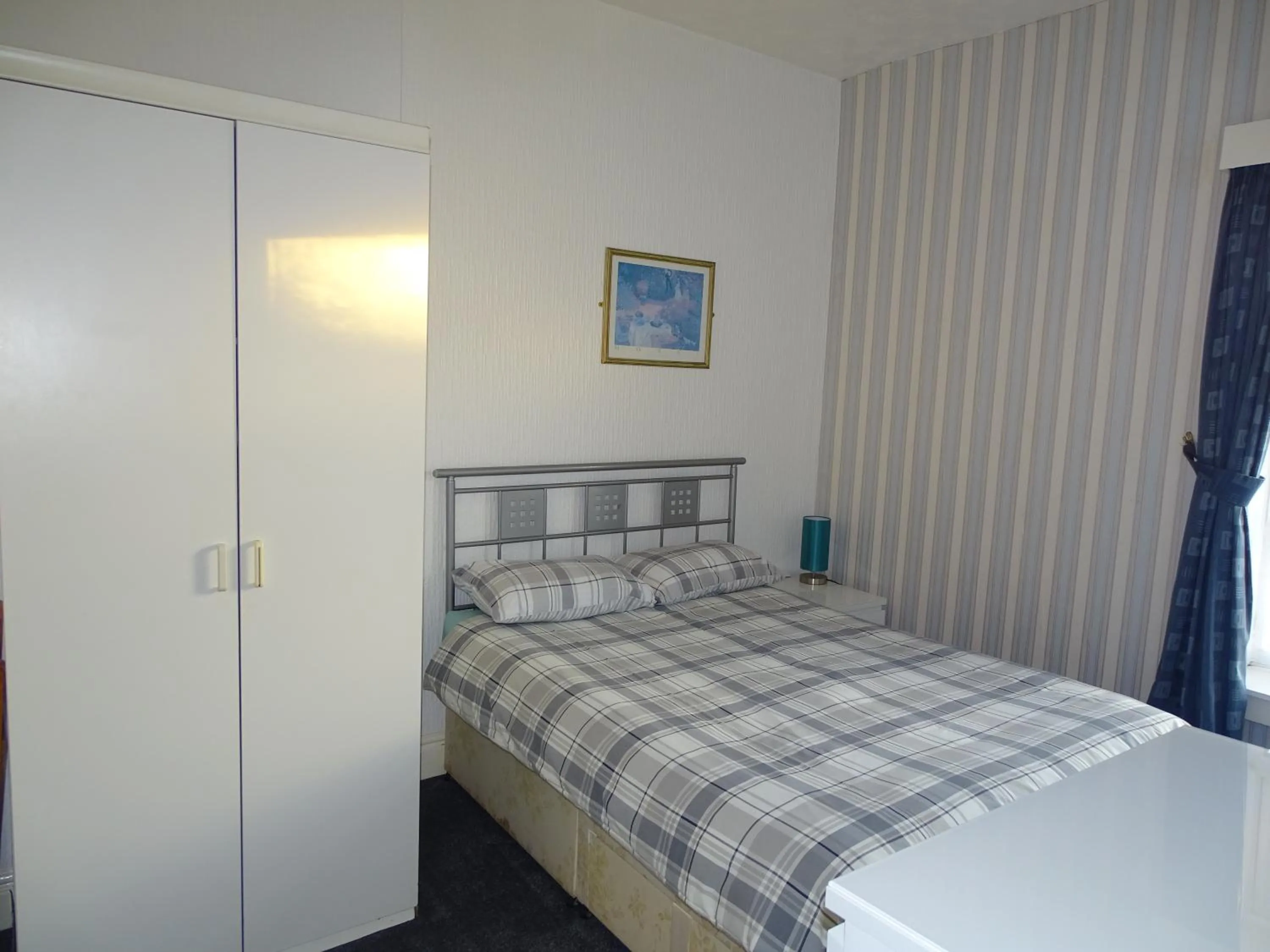 Bed in Beeton Villas Holiday Apartments