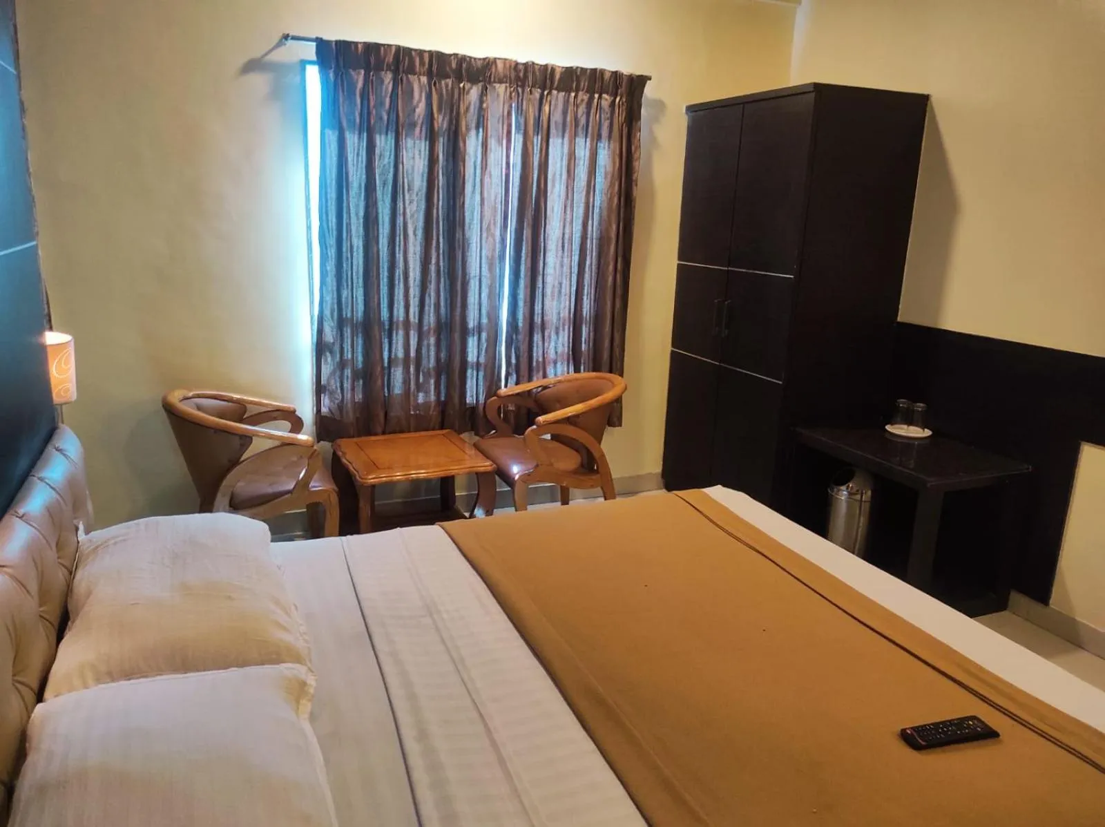 Seating area, Bed in Hotel Vaishnavi