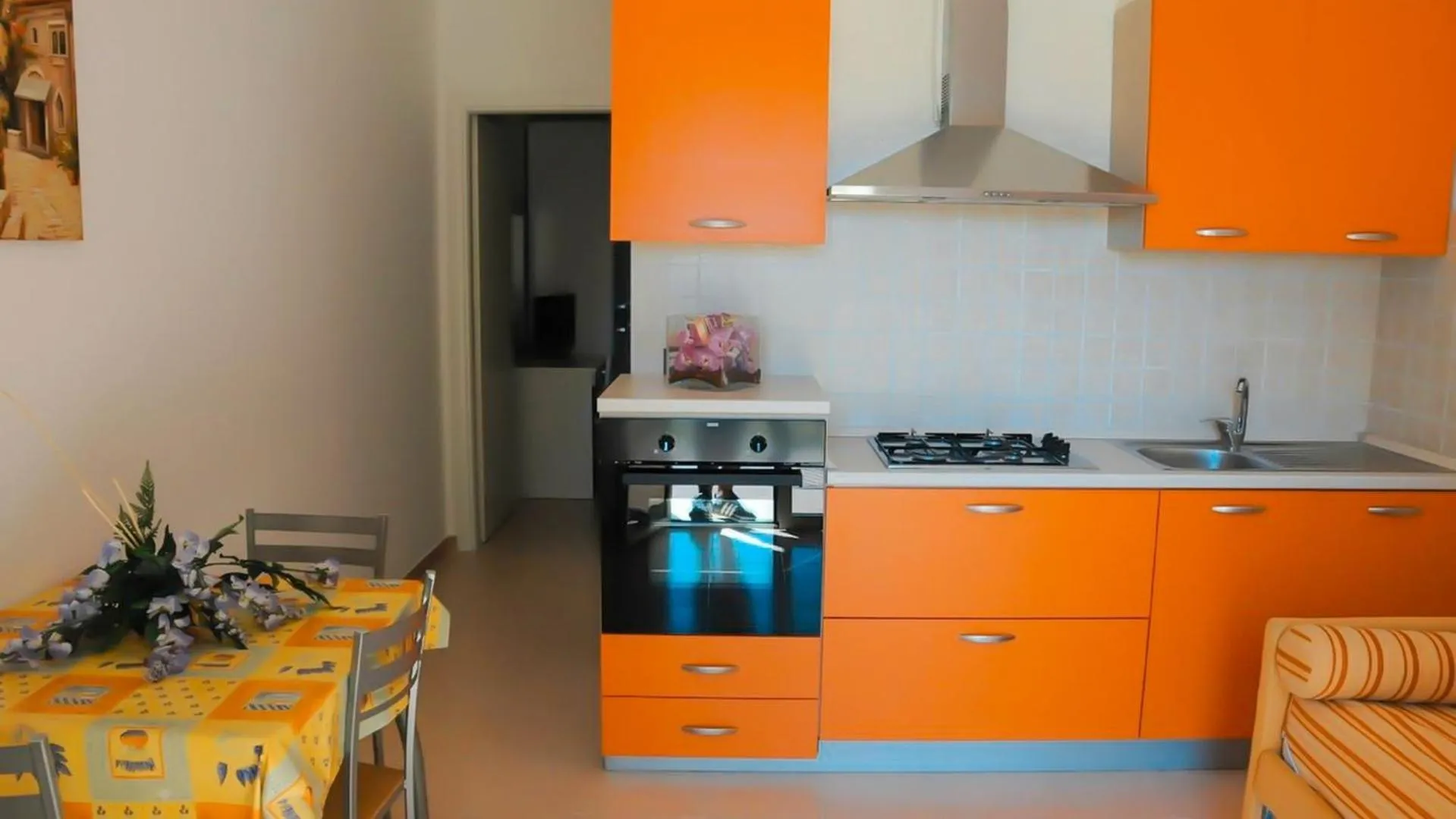 Living room, Kitchen/Kitchenette in Villaggio & Residence Club Aquilia