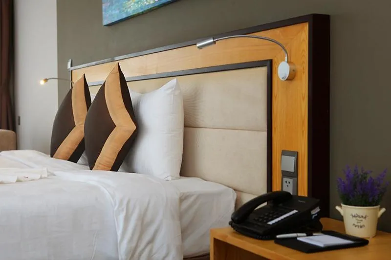 Bed in Dragon Sea Hotel