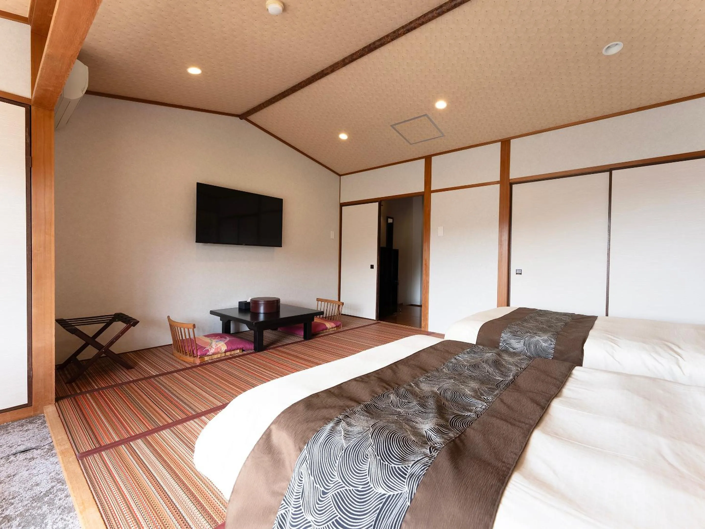 Bed in Livemax Resort Yuhigaura Kitu Onsen