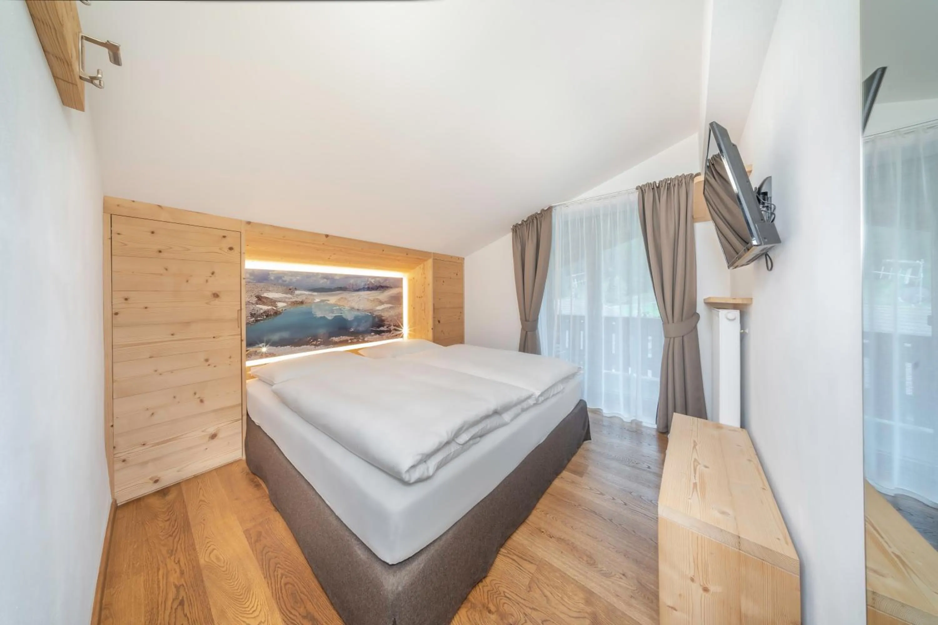 Photo of the whole room, Bed in Garni Tramans