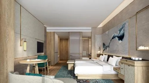 Photo of the whole room, Bed in HUALUXE Beihai Silver Beach Resort by IHG