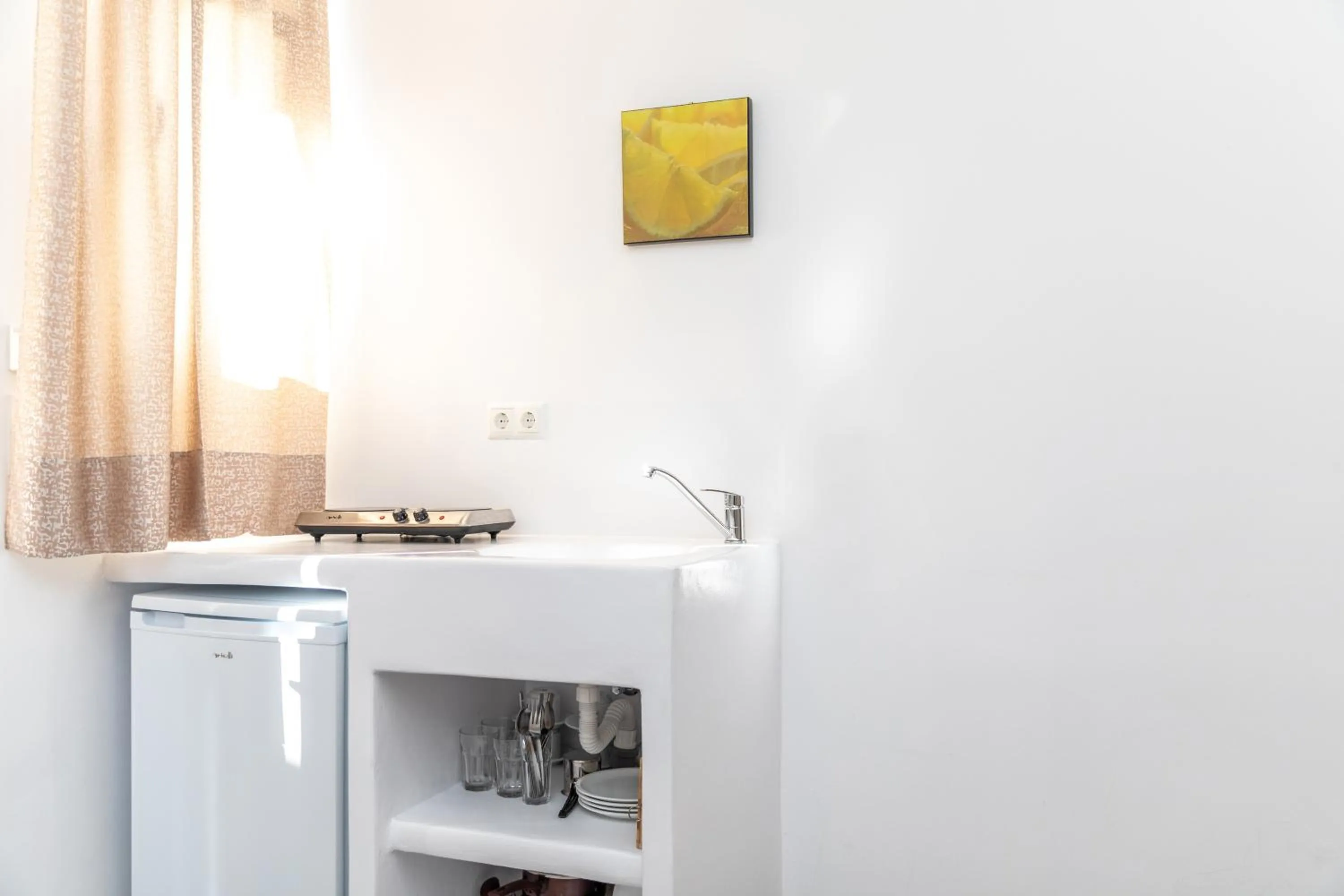 Kitchen or kitchenette in Depis luxury suites