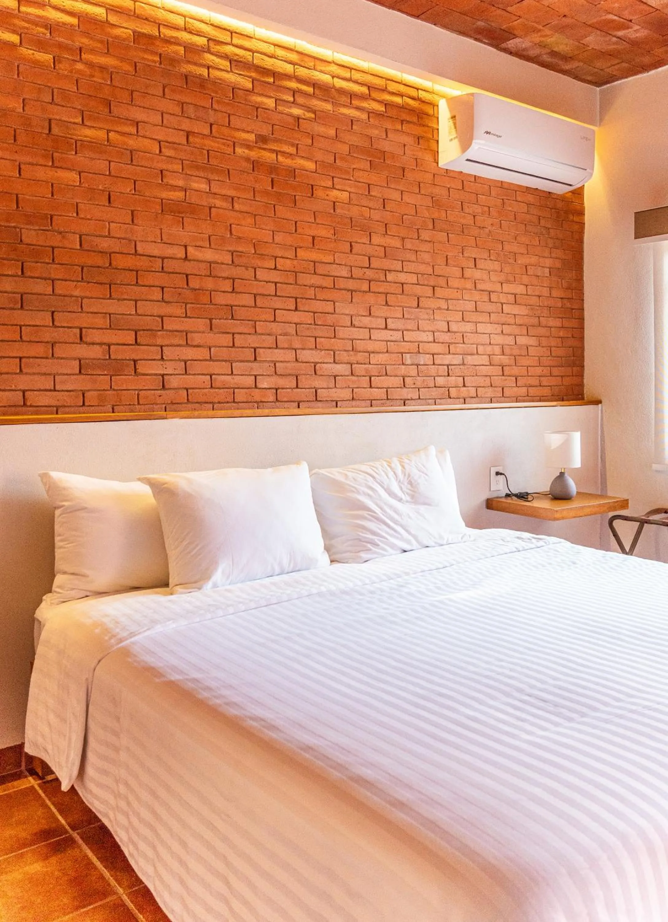 air conditioner, Bed in La Posada Hotel Boutique