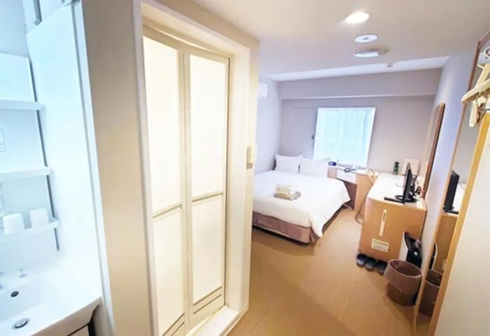 Bed in Quintessa Hotel Akita