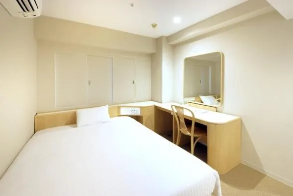 Bed in Quintessa Hotel Akita