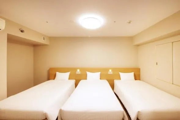 Bed in Quintessa Hotel Akita