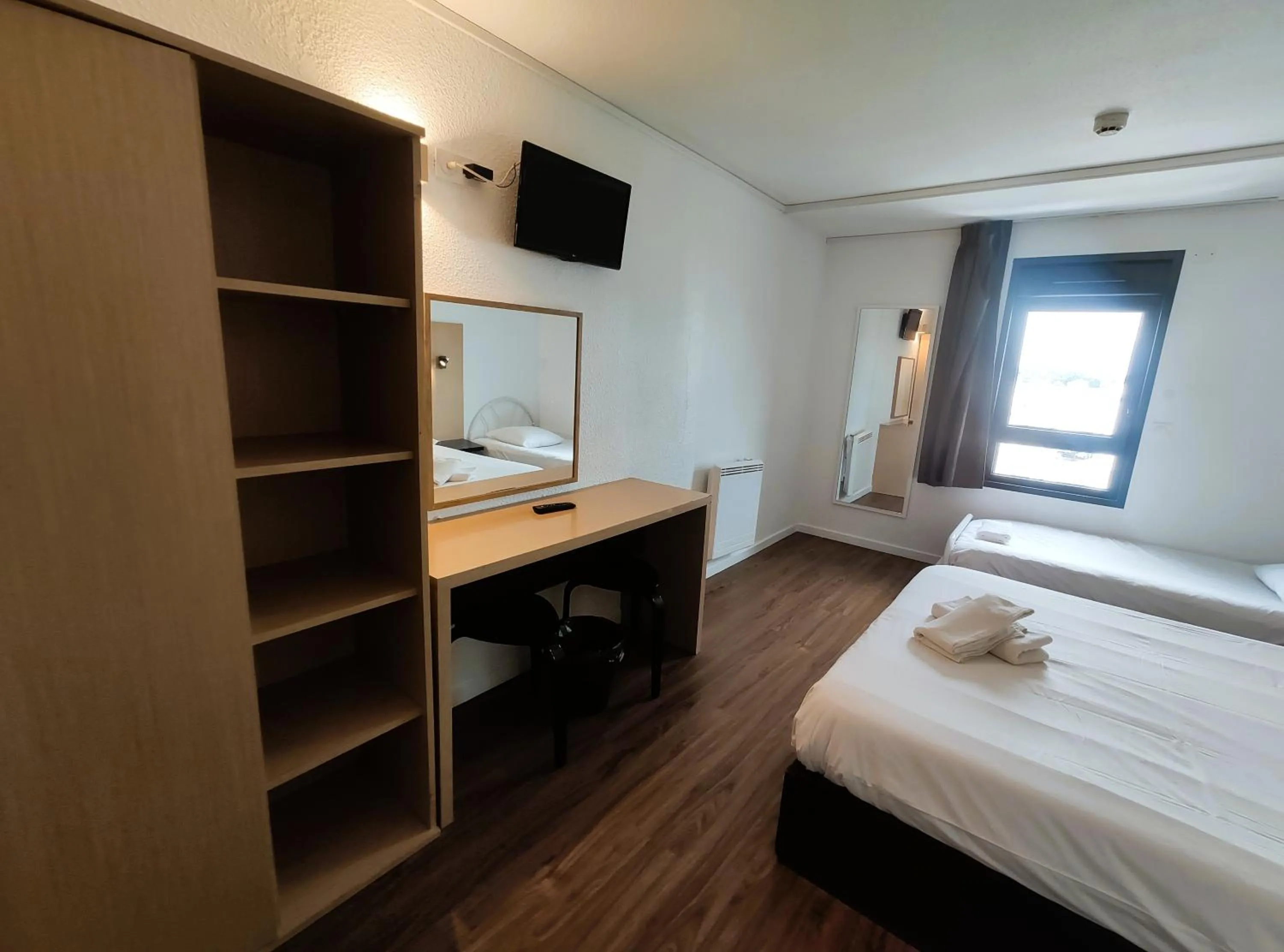 wardrobe, Bed in Hôtel Akena Pierrelaye