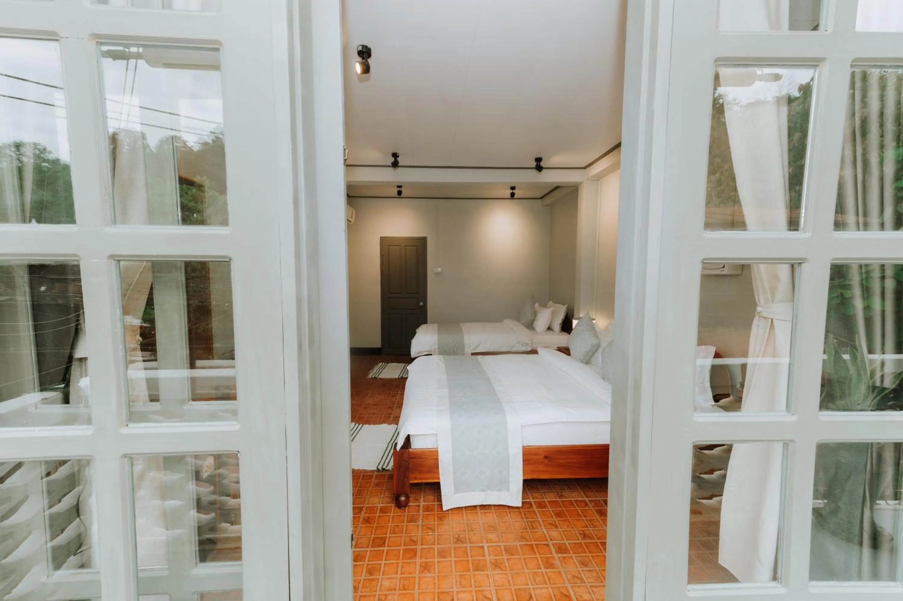 Bed in SamaiLaos Residence