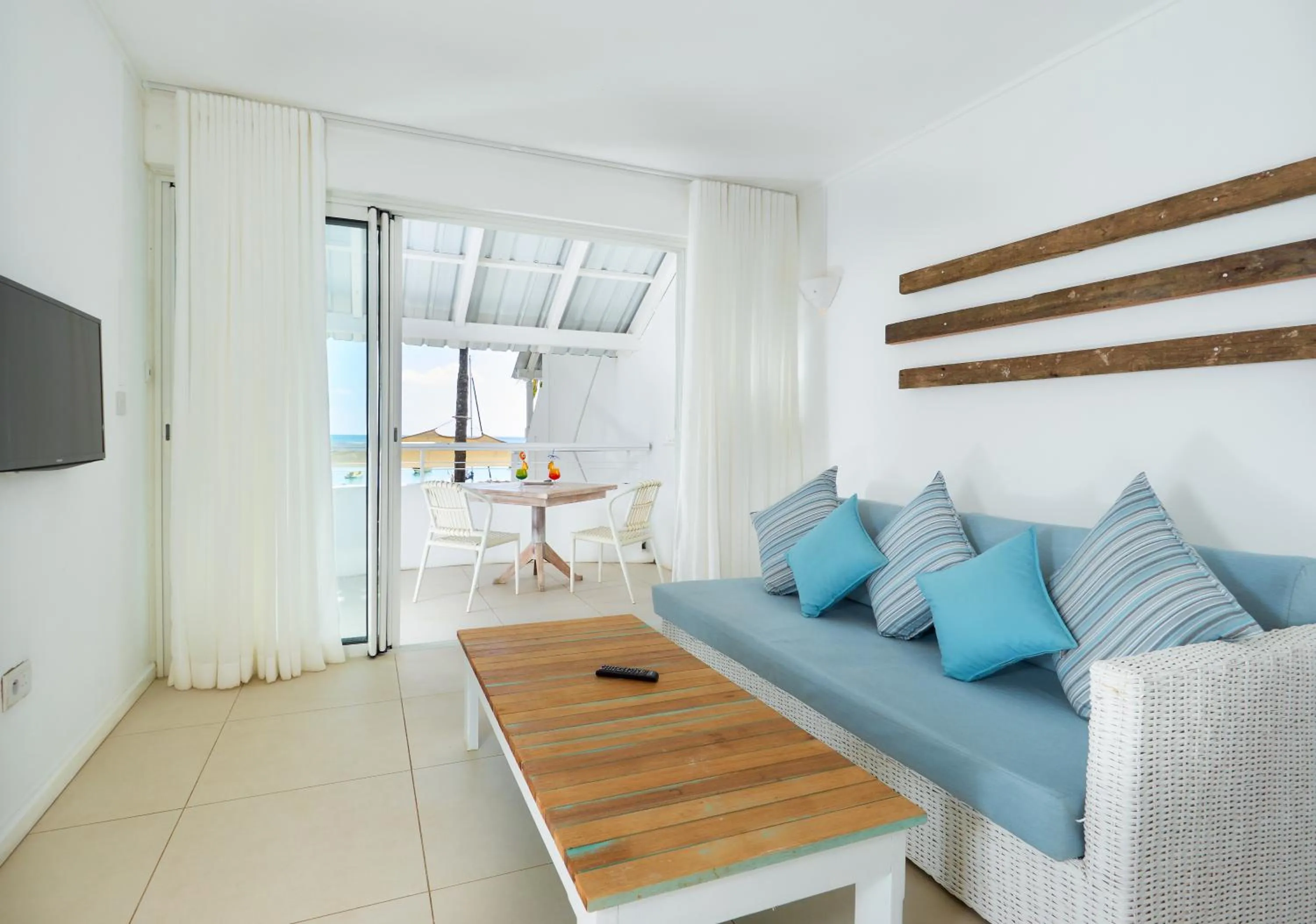 Communal lounge/ TV room in Le Beachclub