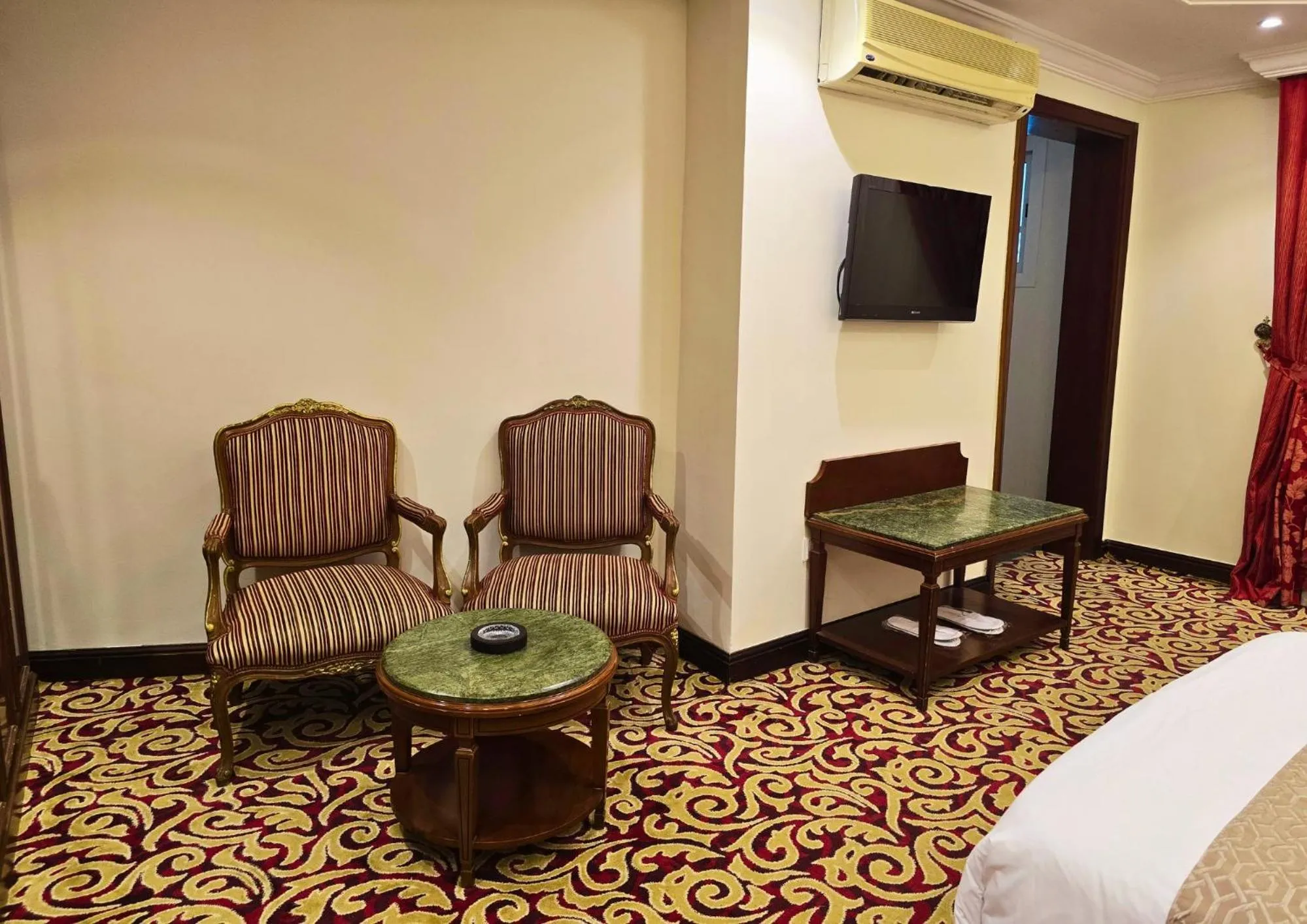 Seating area, Bed in Taj Celine Hotel