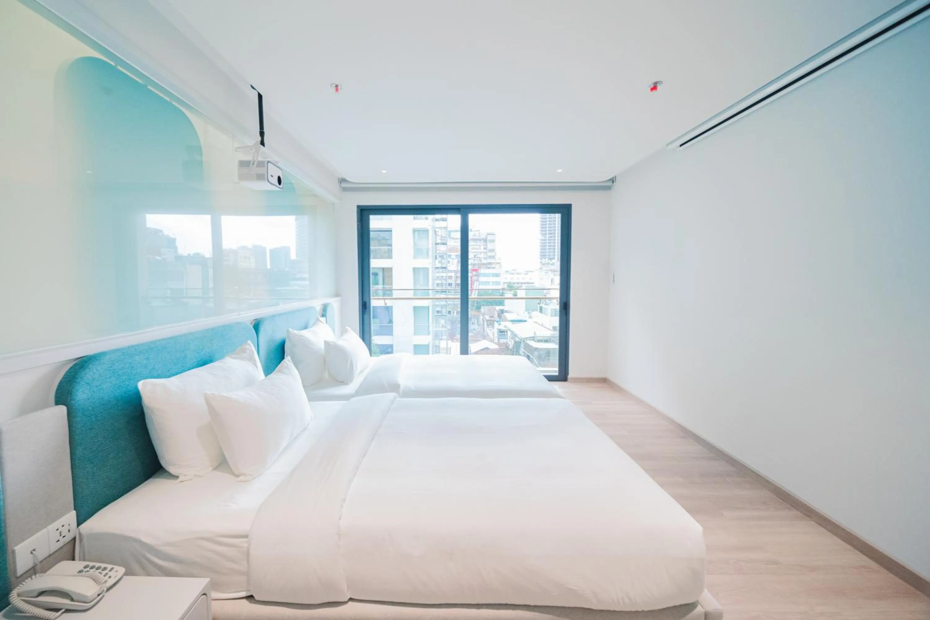 Bedroom, Bed in IconSphere Hotel