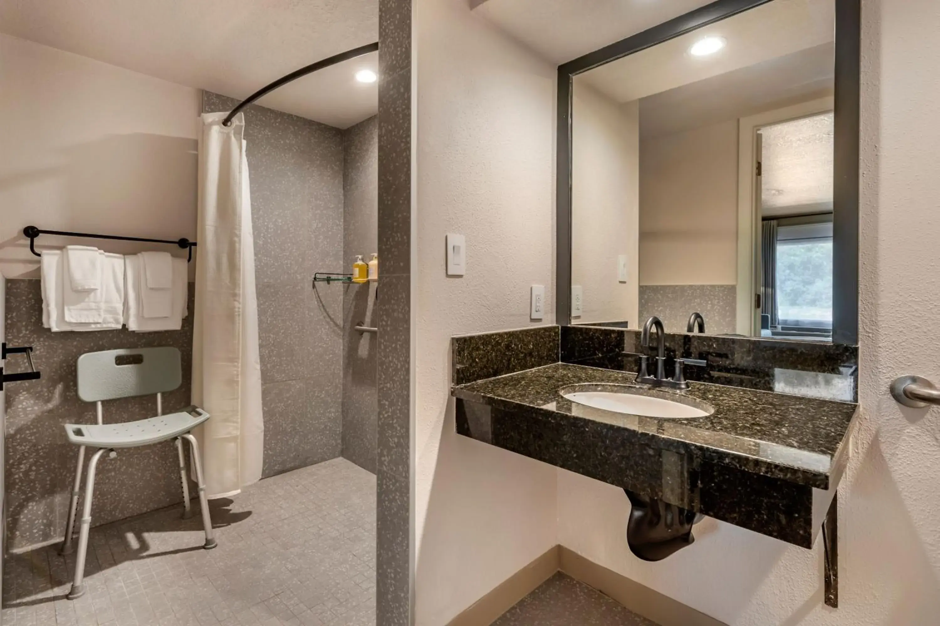 Standard King Room with Mobility Accessible Roll-In Shower in voco Kissimmee Orlando by IHG Standard King Room with Mobility Accessible Roll-In Shower in voco Kissimmee Orlando by IHG