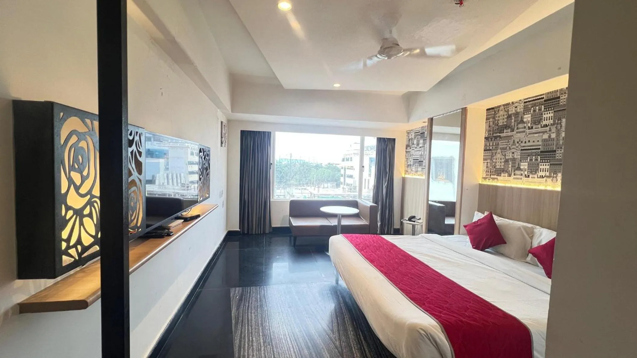 Photo of the whole room, Bed in Hotel Manorama Vijayawada