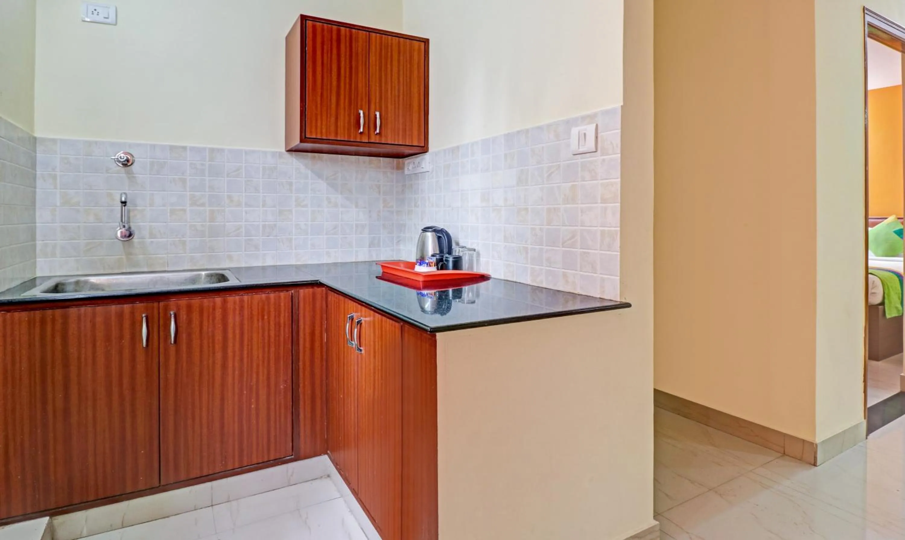 Kitchen or kitchenette in Treebo Akshaya Mayflower Vijaya Bank Layout