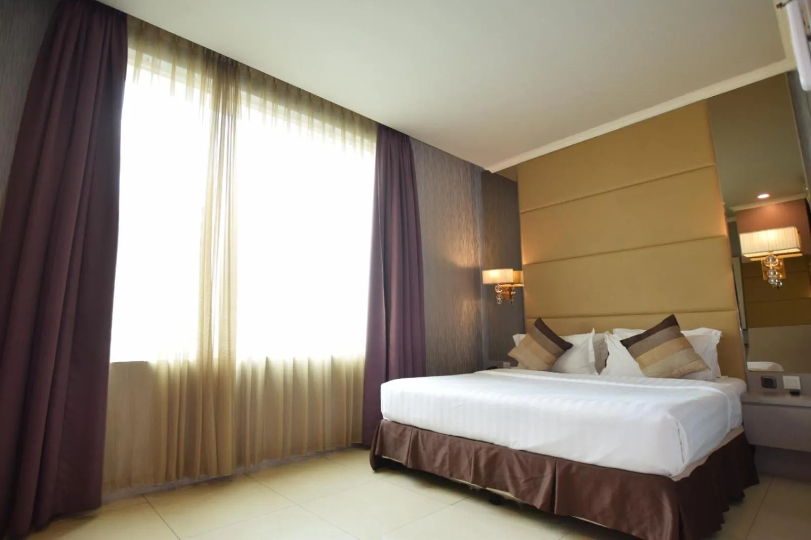 Bed in Grand Paragon Hotel