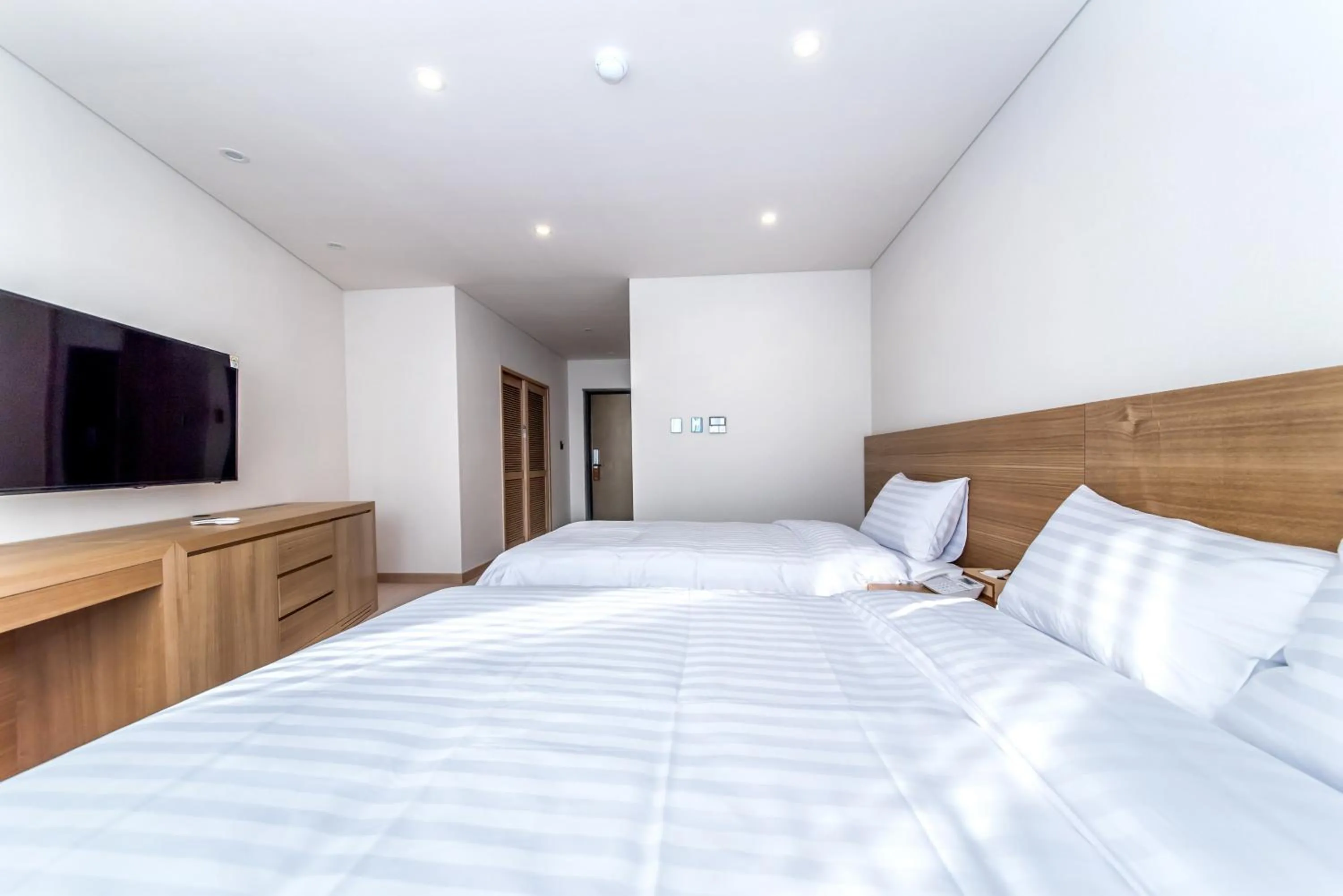 Photo of the whole room, Bed in BK Hotel Jeju