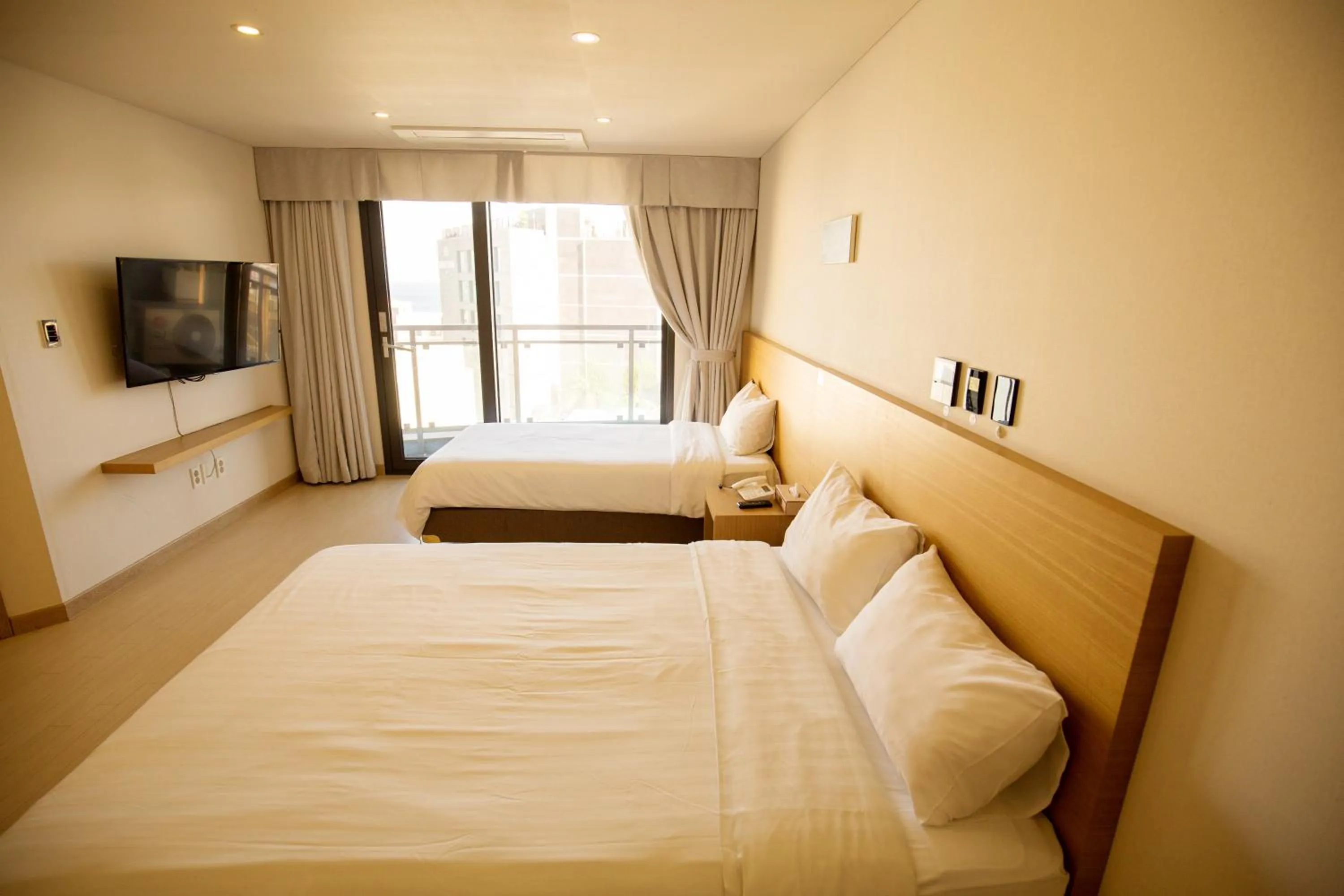 Bed in BK Hotel Jeju