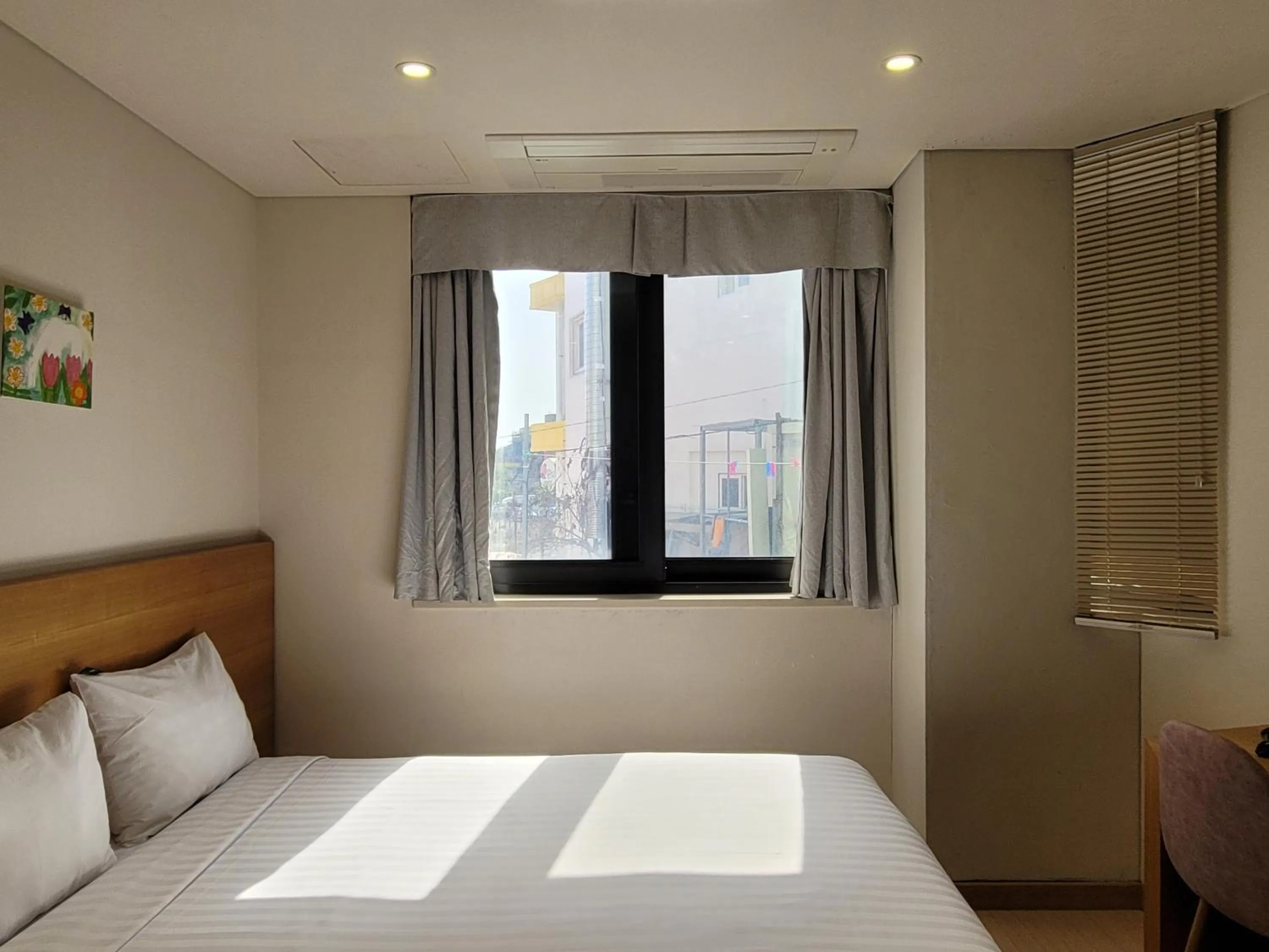 View (from property/room), Bed in BK Hotel Jeju