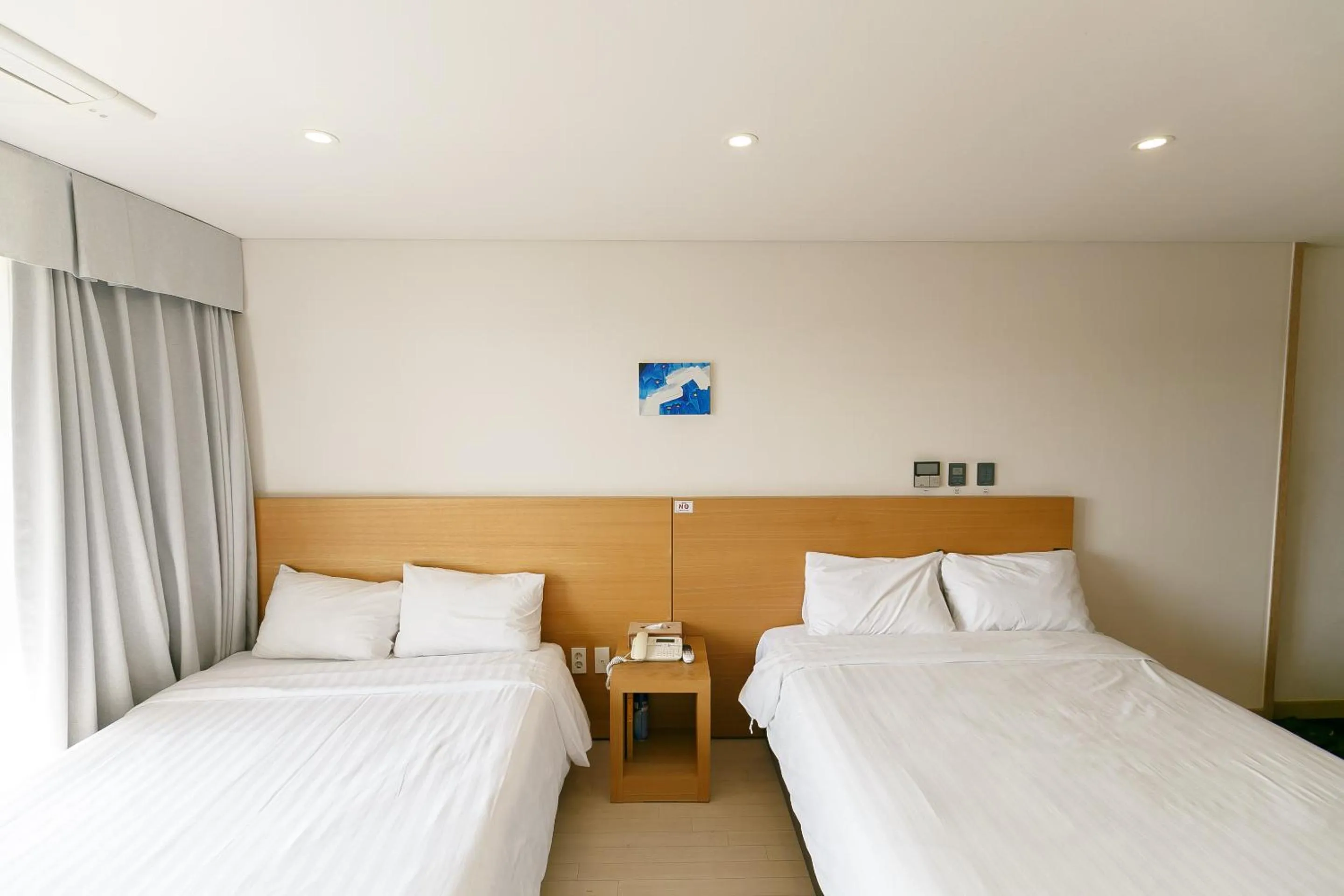 Bed in BK Hotel Jeju