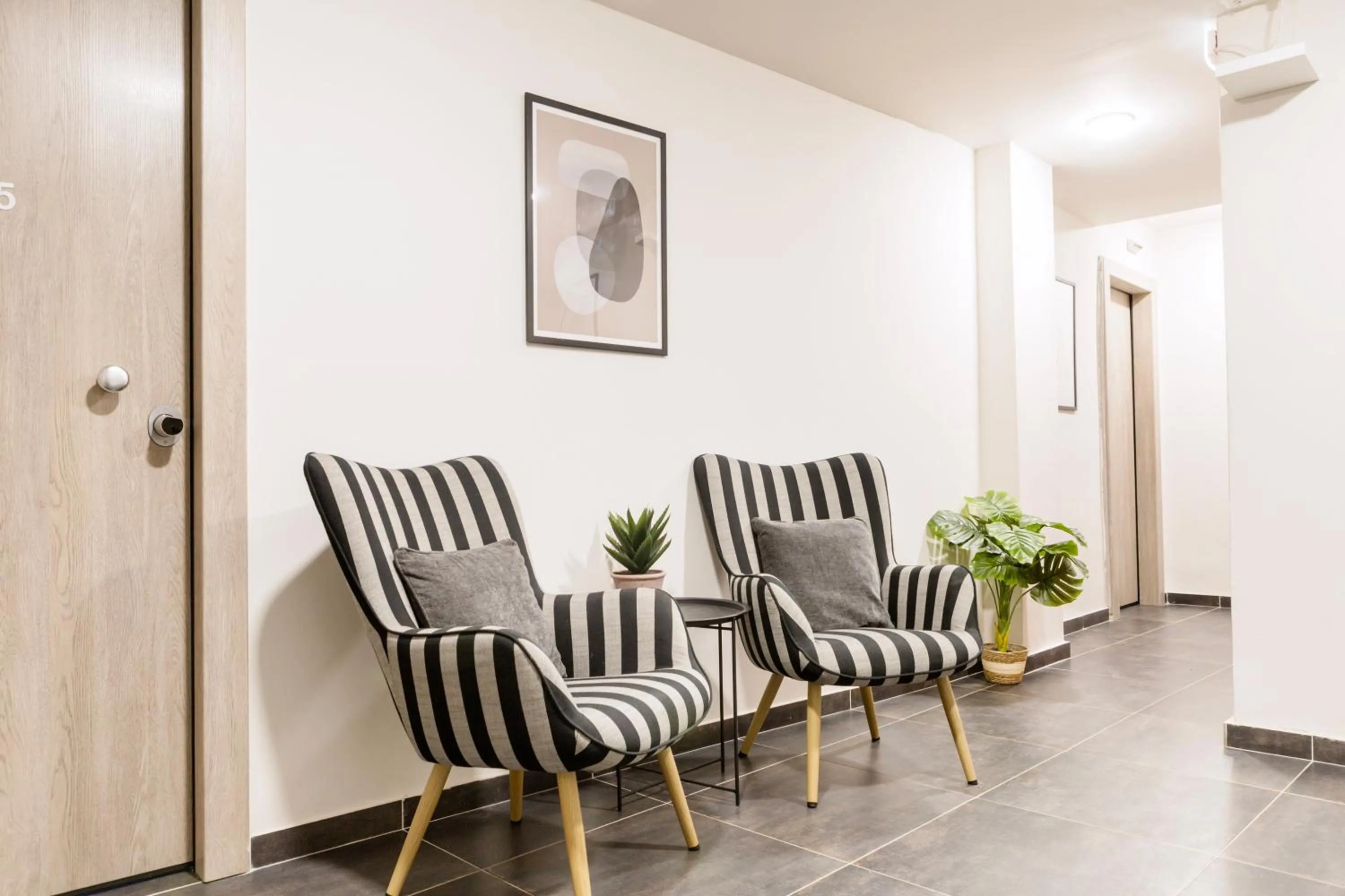 Communal lounge/ TV room in AEONS - Hotelia Hospitality Group