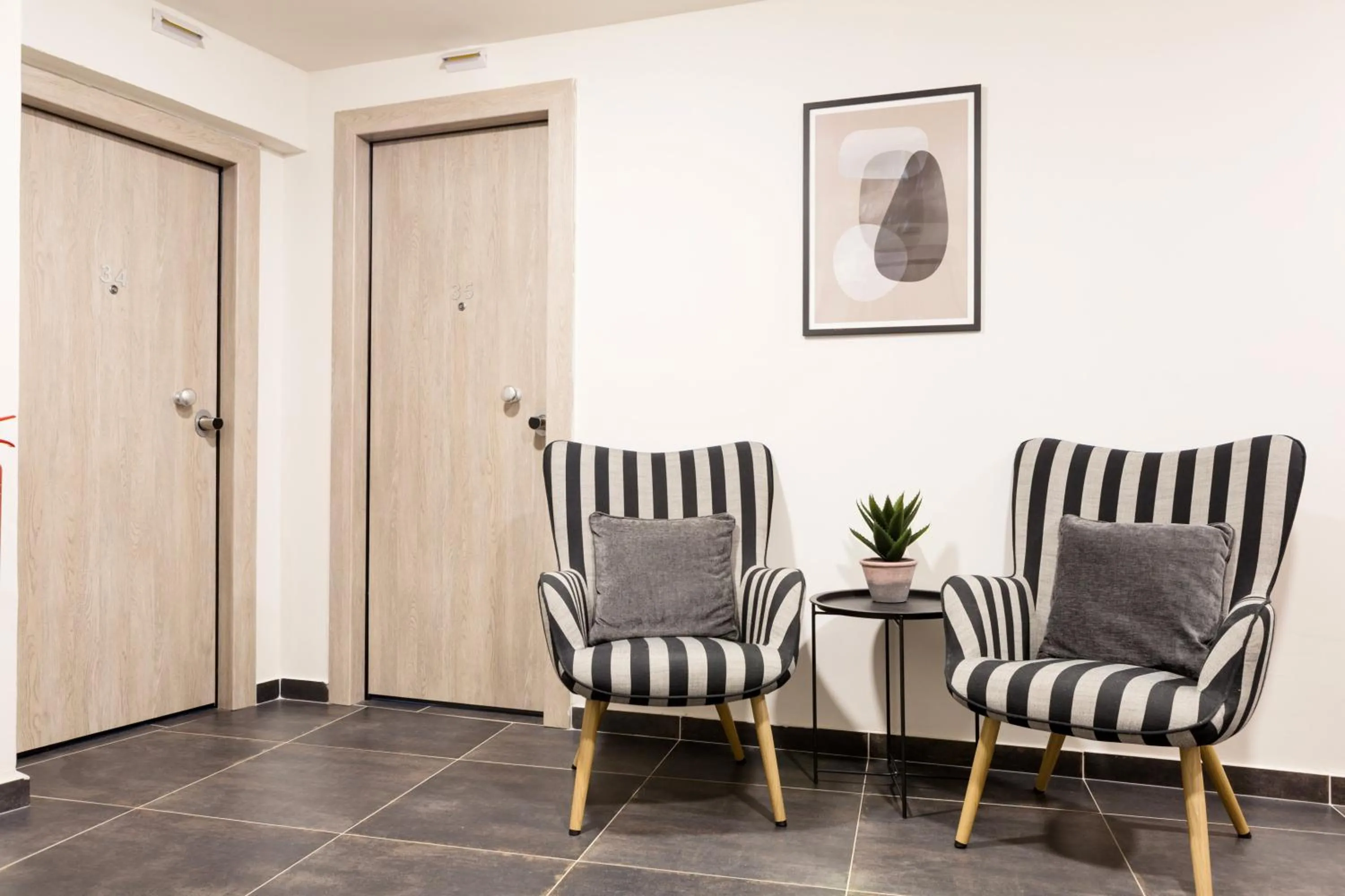 Communal lounge/ TV room in AEONS - Hotelia Hospitality Group