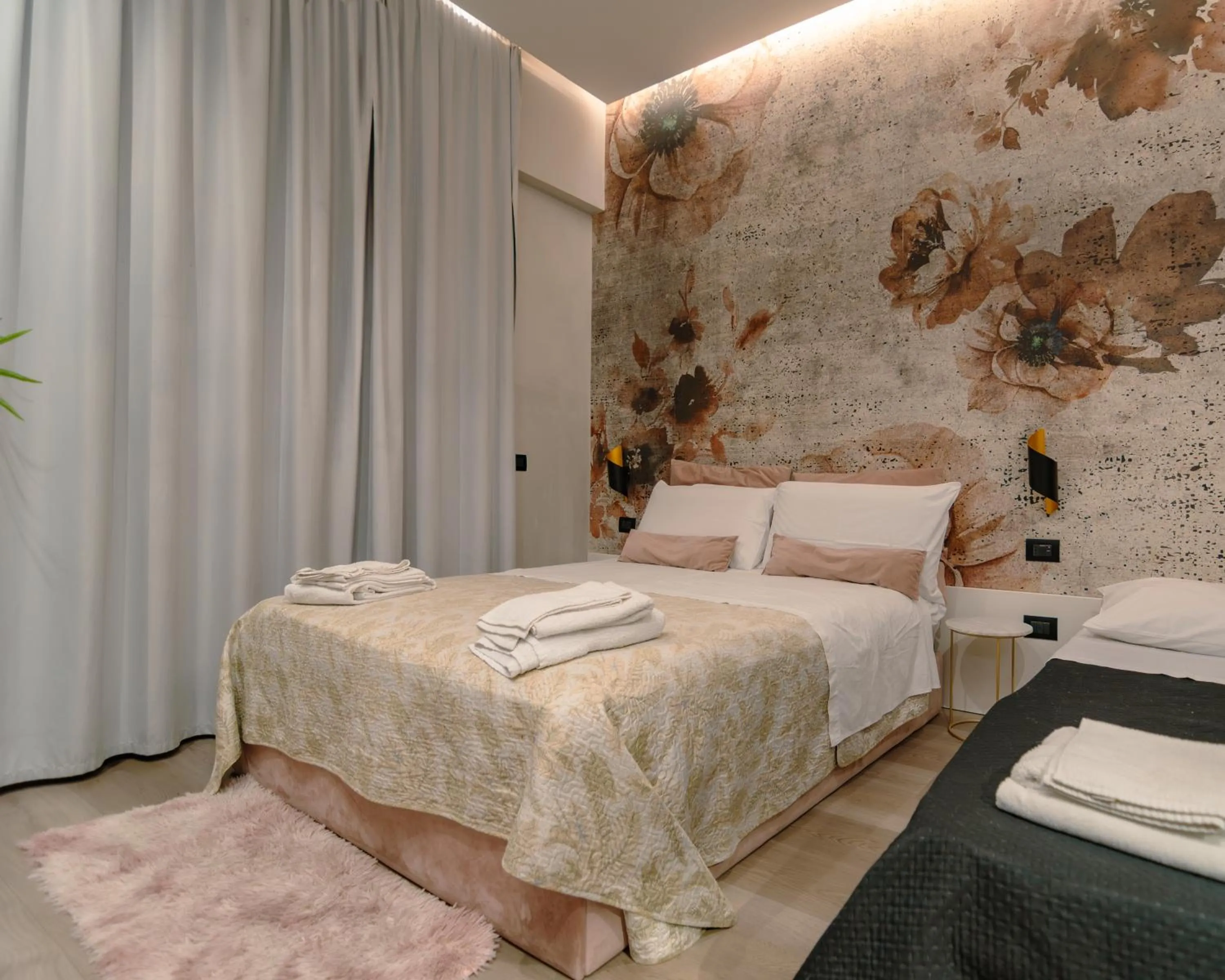 Bed in VESUVIANUS Rooms and More